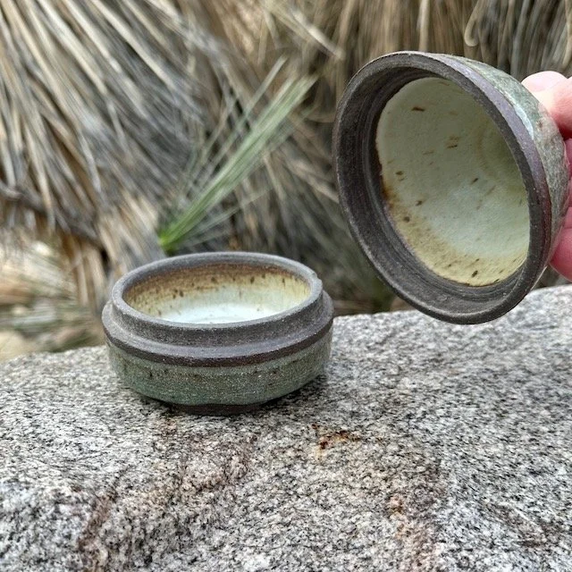 Small pointed lidded jar, black mountain, lid off