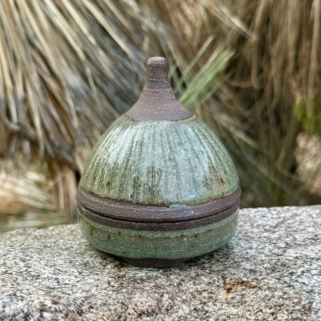 Small pointed lidded jar, black mountain