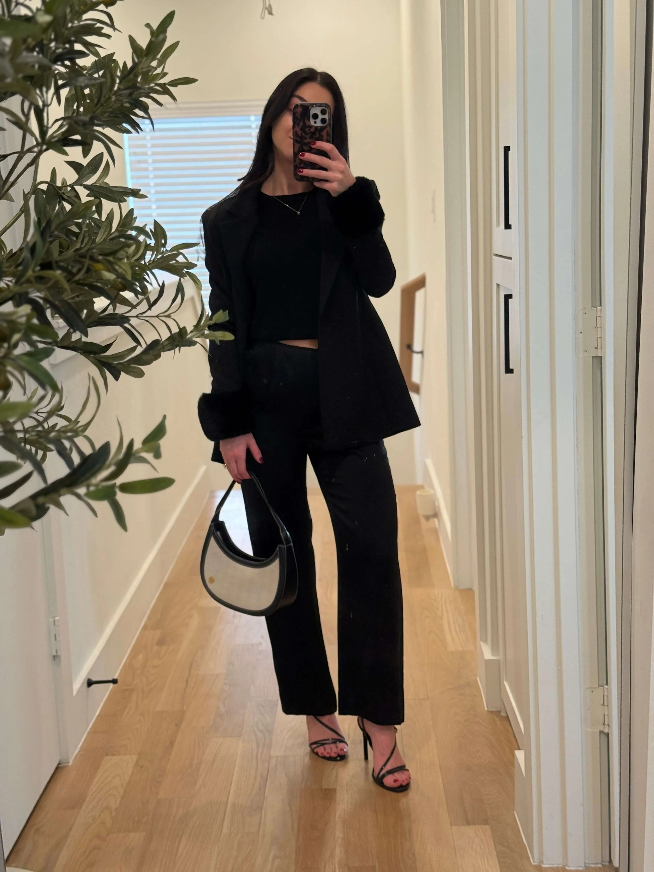 Elevated all-black outfit styled by Shop Lucky Club personal stylist with tailored blazer and straight-leg pants.
