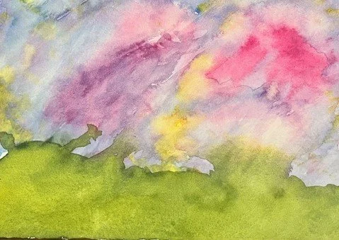 Watercolor painting of pink and purple clouds over a green landscape.