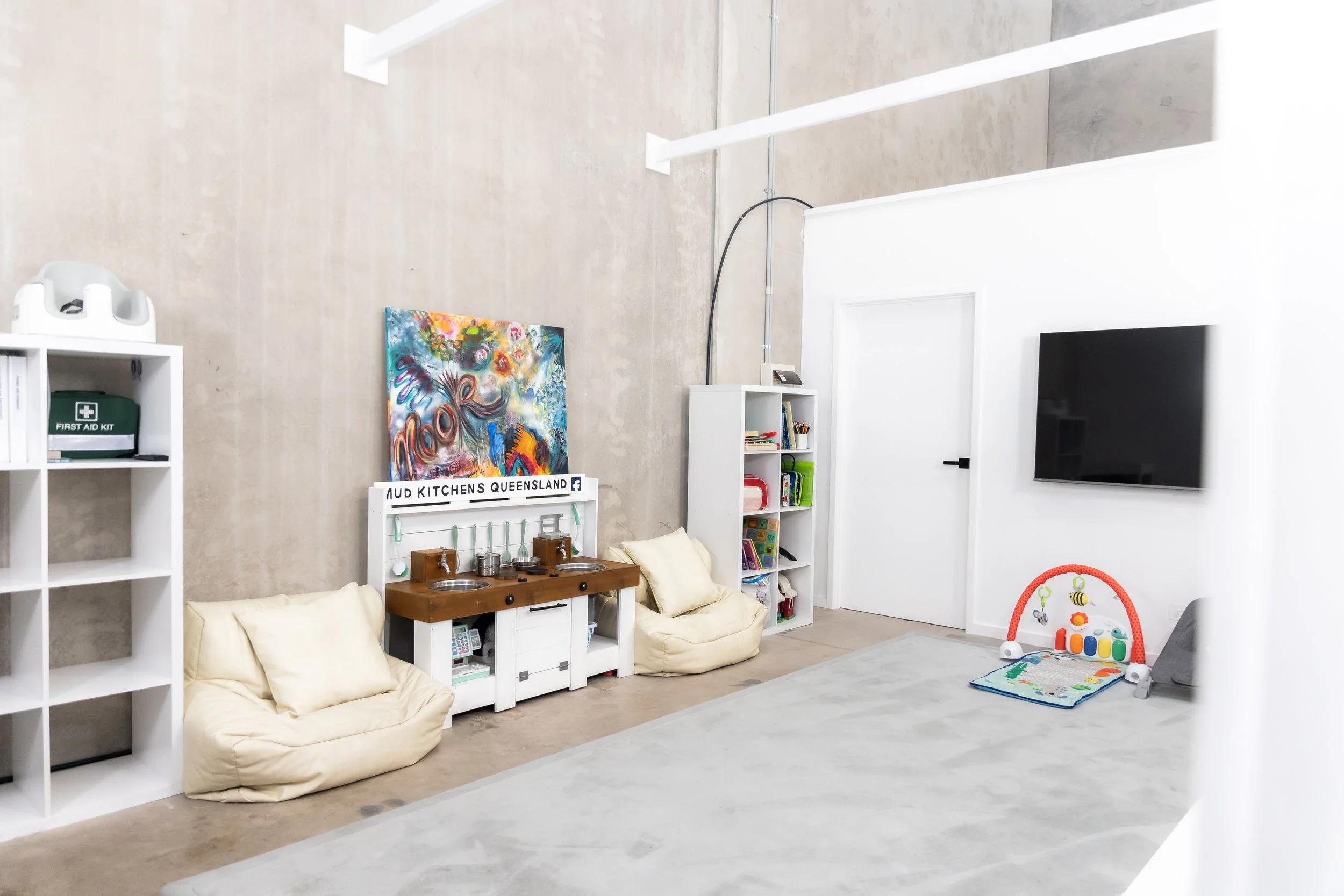 Staffed kids room at Nook Collective, filled with toys, colorful play areas, and cozy seating. A safe, fun, and engaging space where children are cared for while parents focus on their tasks nearby