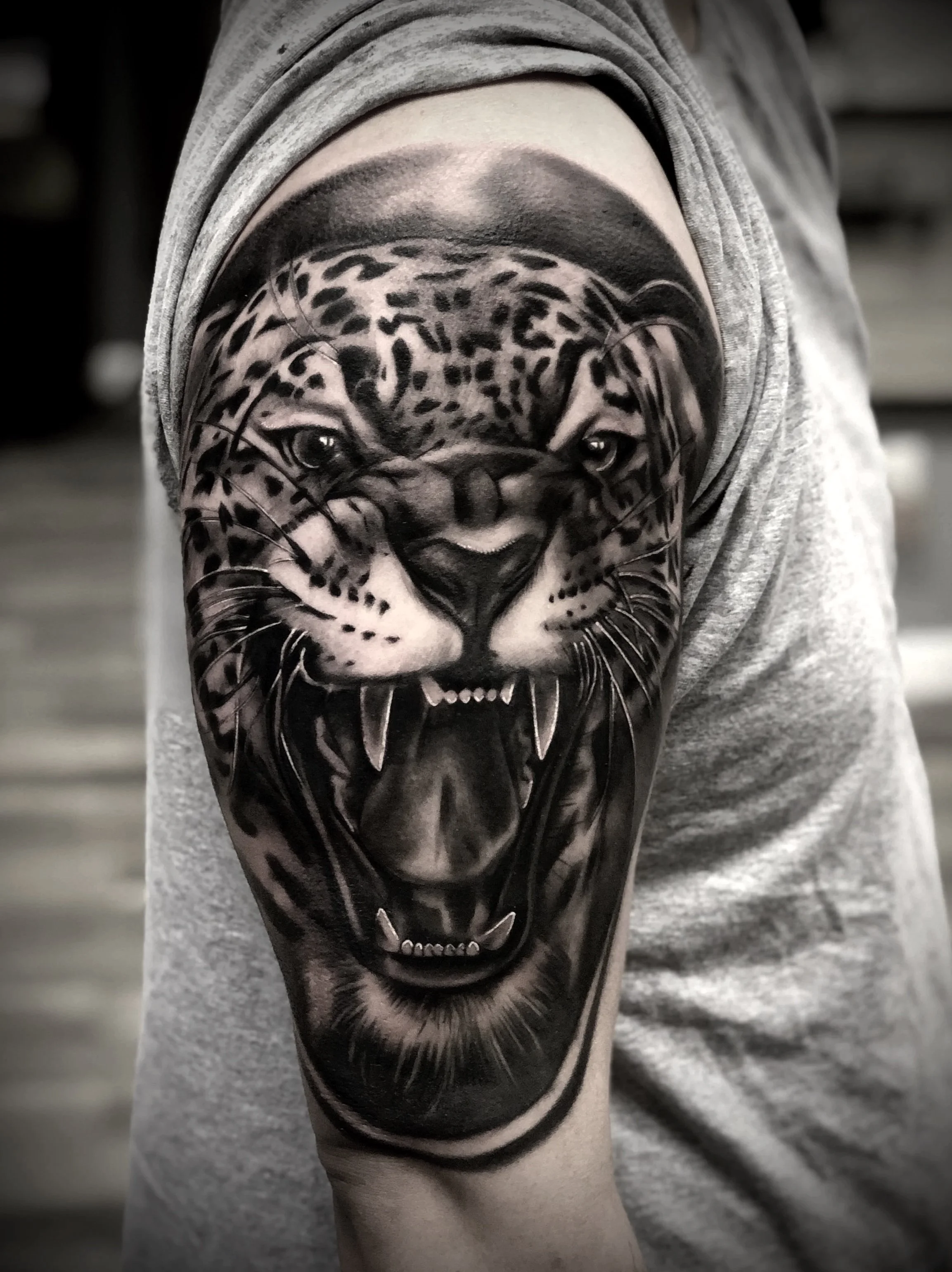 Jaguar Black and Grey Arm Tattoo