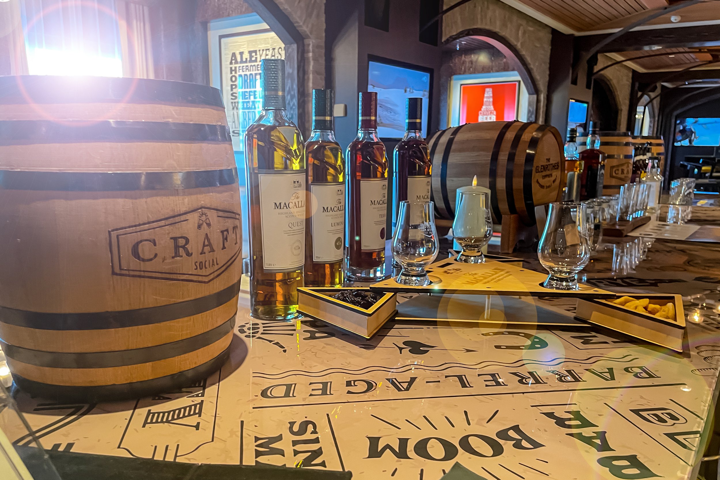 Bar equipment / branded assets: brand applied across product surfaces