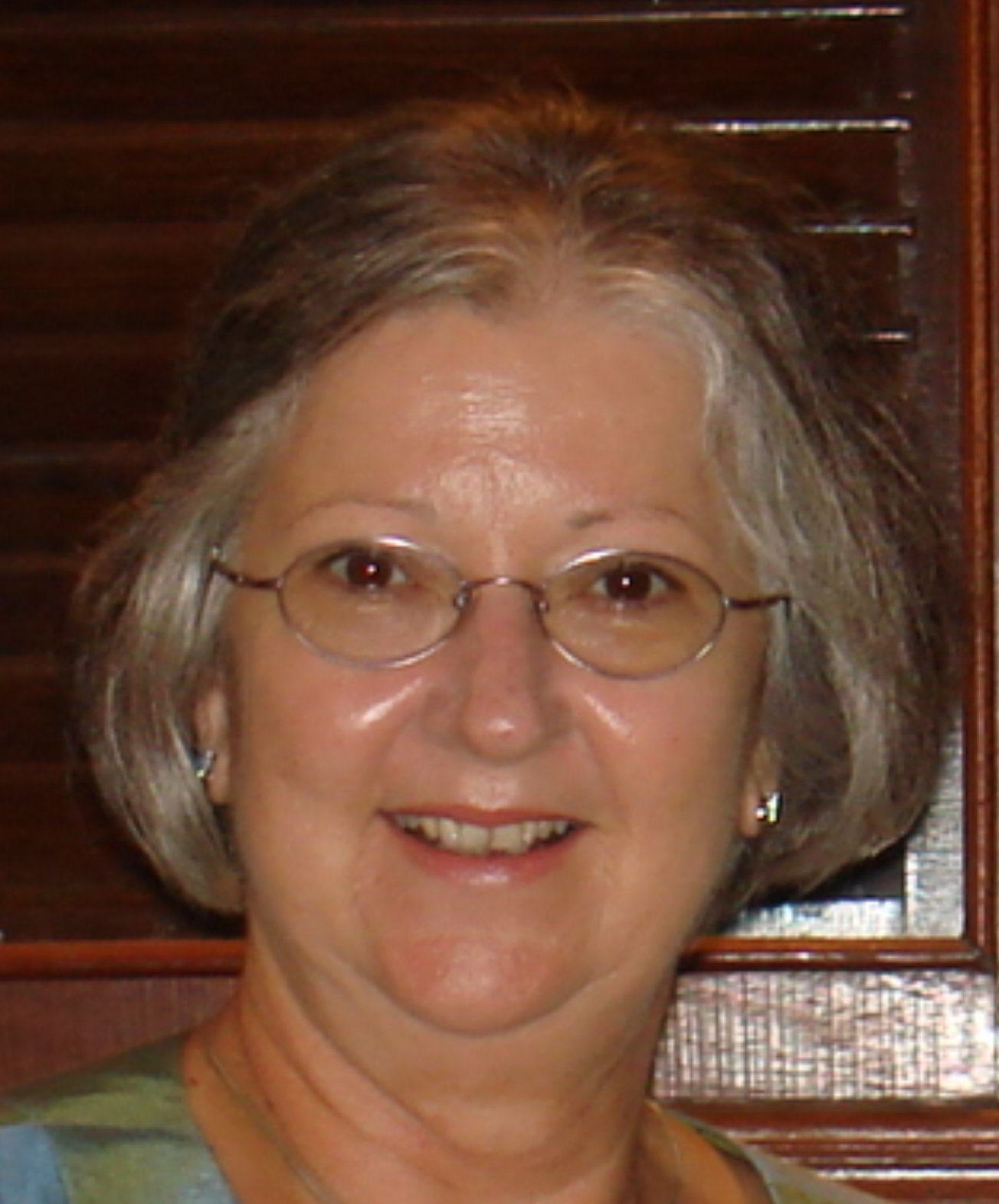 Woman name Jenny Pearson with white short hair and glasses