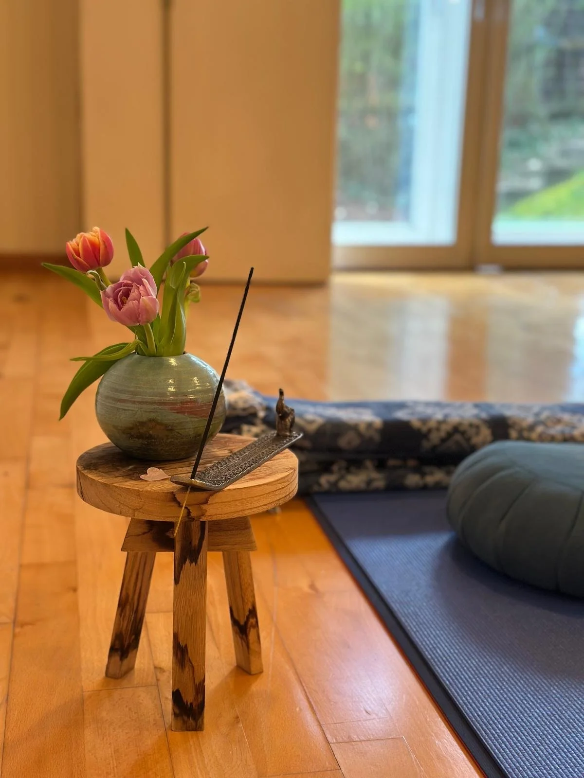 Welcoming Energy in Motion Tai Chi studio entrance with fresh flowers and mindful decor