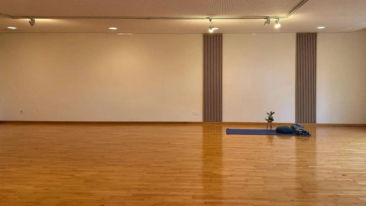 Spacious Tai Chi practice studio with wooden floors and natural light at Energy in Motion