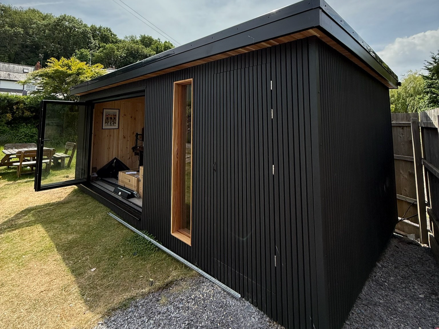 Black composite and cedar garden room and 2 man sauna combination.
