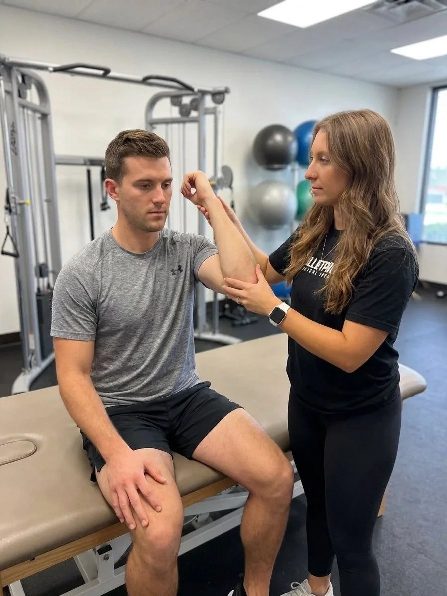 Patient working with a provider at a sports physical therapy clinic in Houston, TX, focusing on shoulder impingement rehabilitation