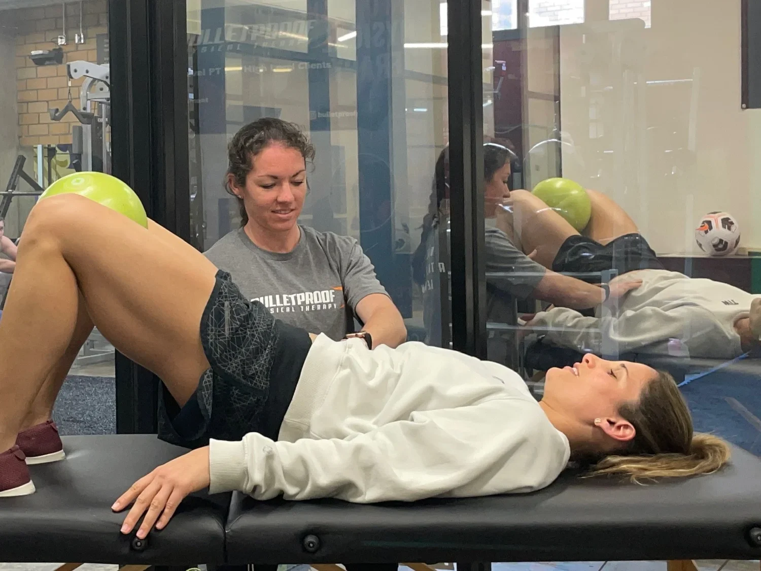 Patient working with a provider at a sports physical therapy clinic in Houston, TX