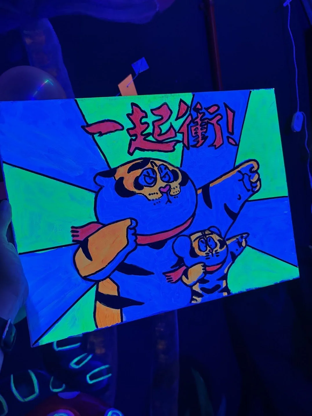 Neon artwork featuring a cartoon tiger and dog dressed as superheroes with Japanese text on a bright background.