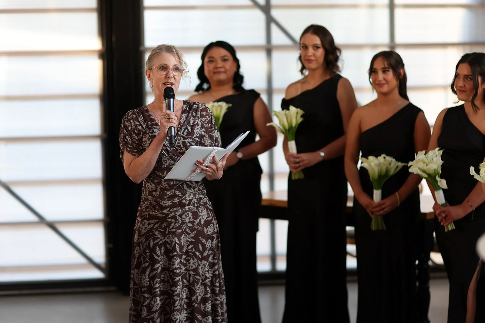 Margaret river celebrant conducting ceremony in wedding chapel with bridesmaid in background