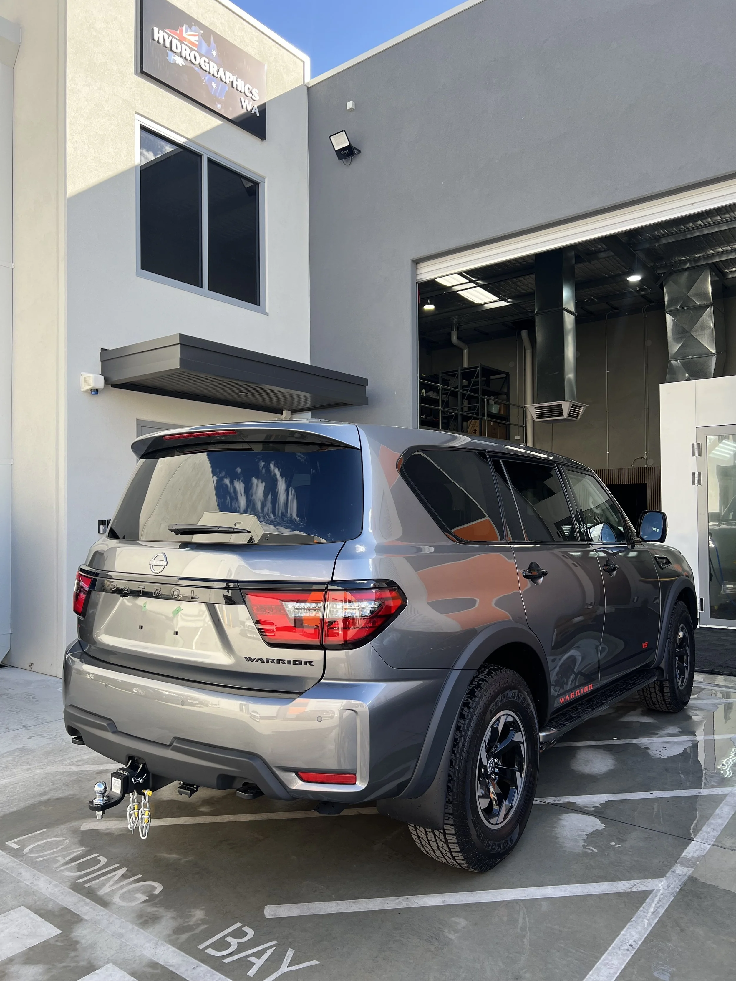 Black SUV exterior chrome delete, exterior blackout Toyota Landcruiser, off-road tires, hydrographics wa