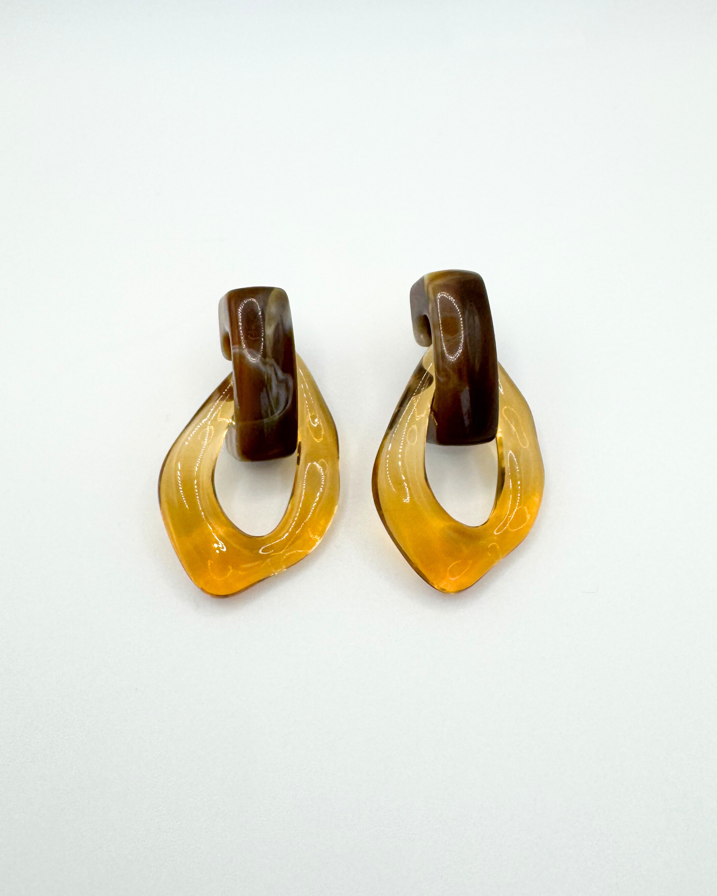 FLOAT earrings by Emilia Burk – lightweight waterproof acrylic statement earrings in clear, green, blue and amber