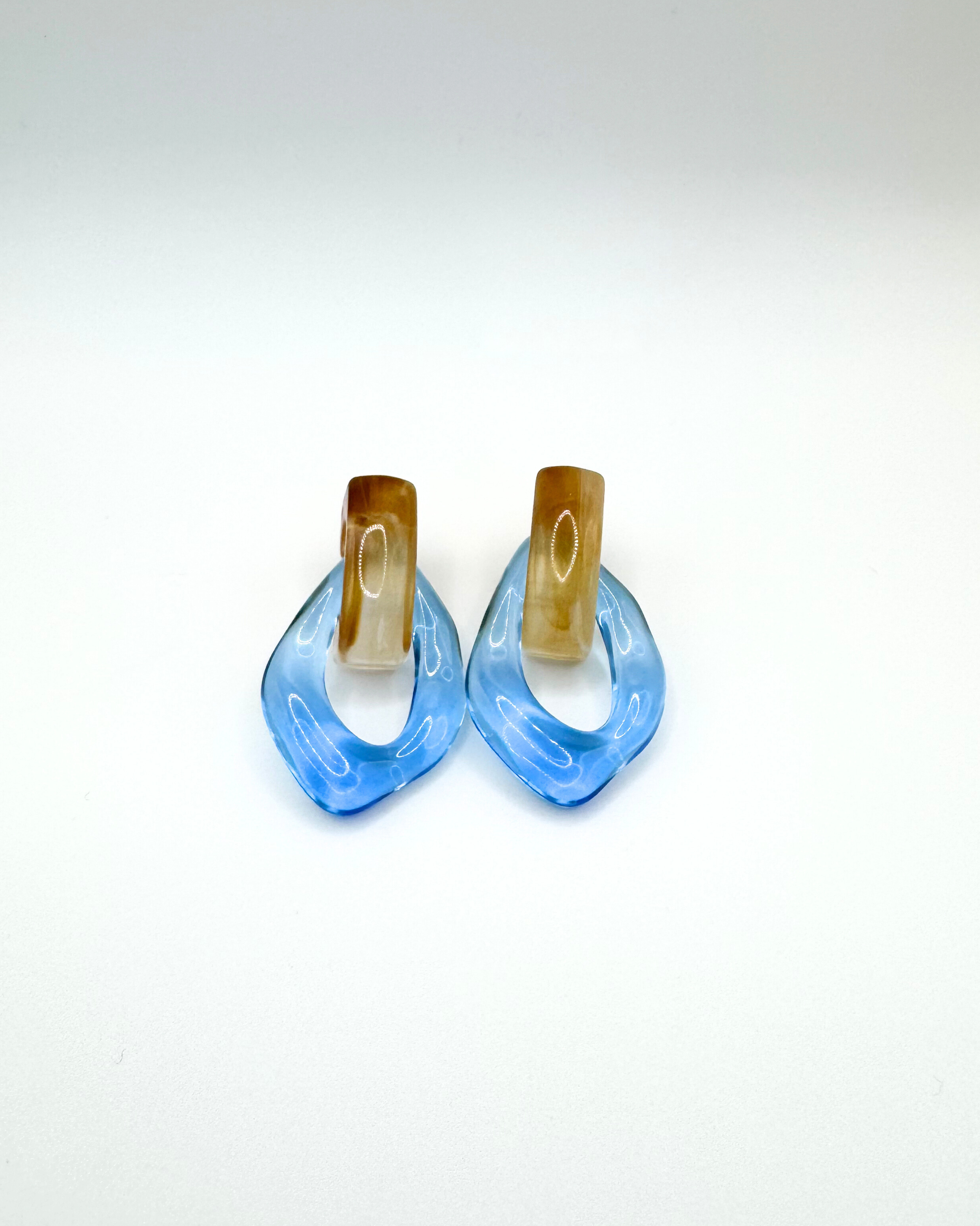 FLOAT earrings by Emilia Burk – lightweight waterproof acrylic statement earrings in clear, green, blue and amber