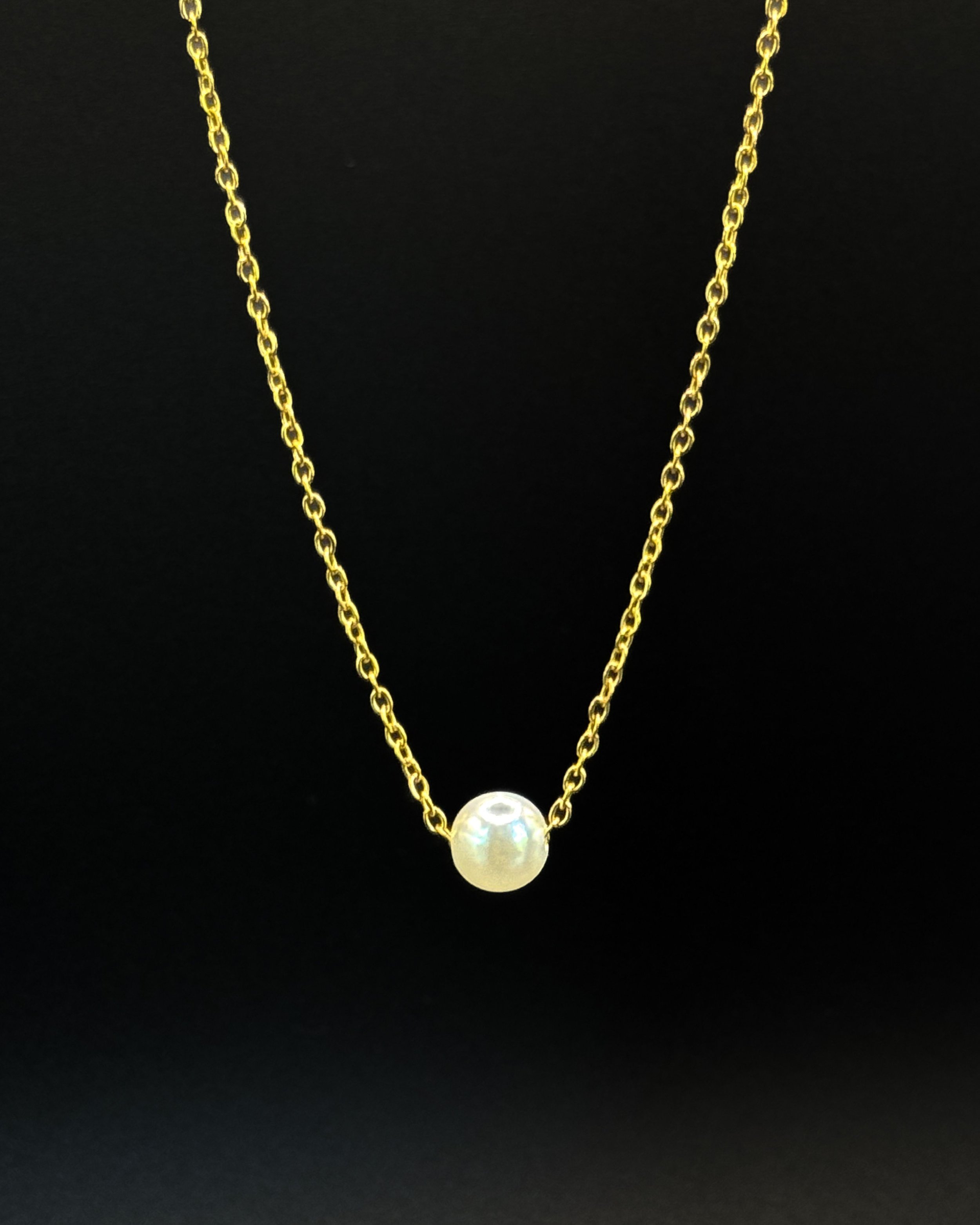 Inma necklace by Emilia Burk – gold chain with floating pearl-look charm, waterproof and tarnish-free