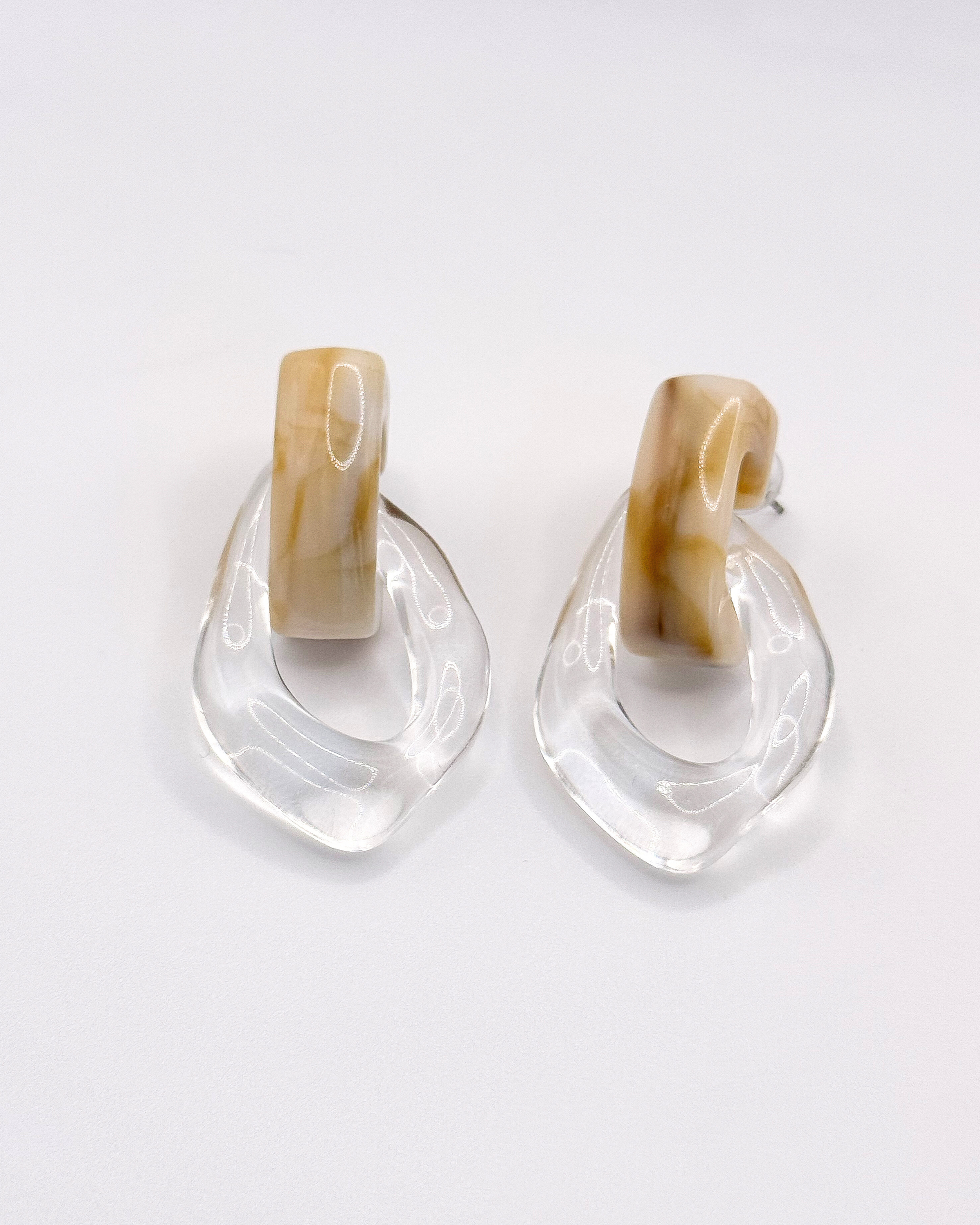 FLOAT earrings by Emilia Burk – lightweight waterproof acrylic statement earrings in clear, green, blue and amber