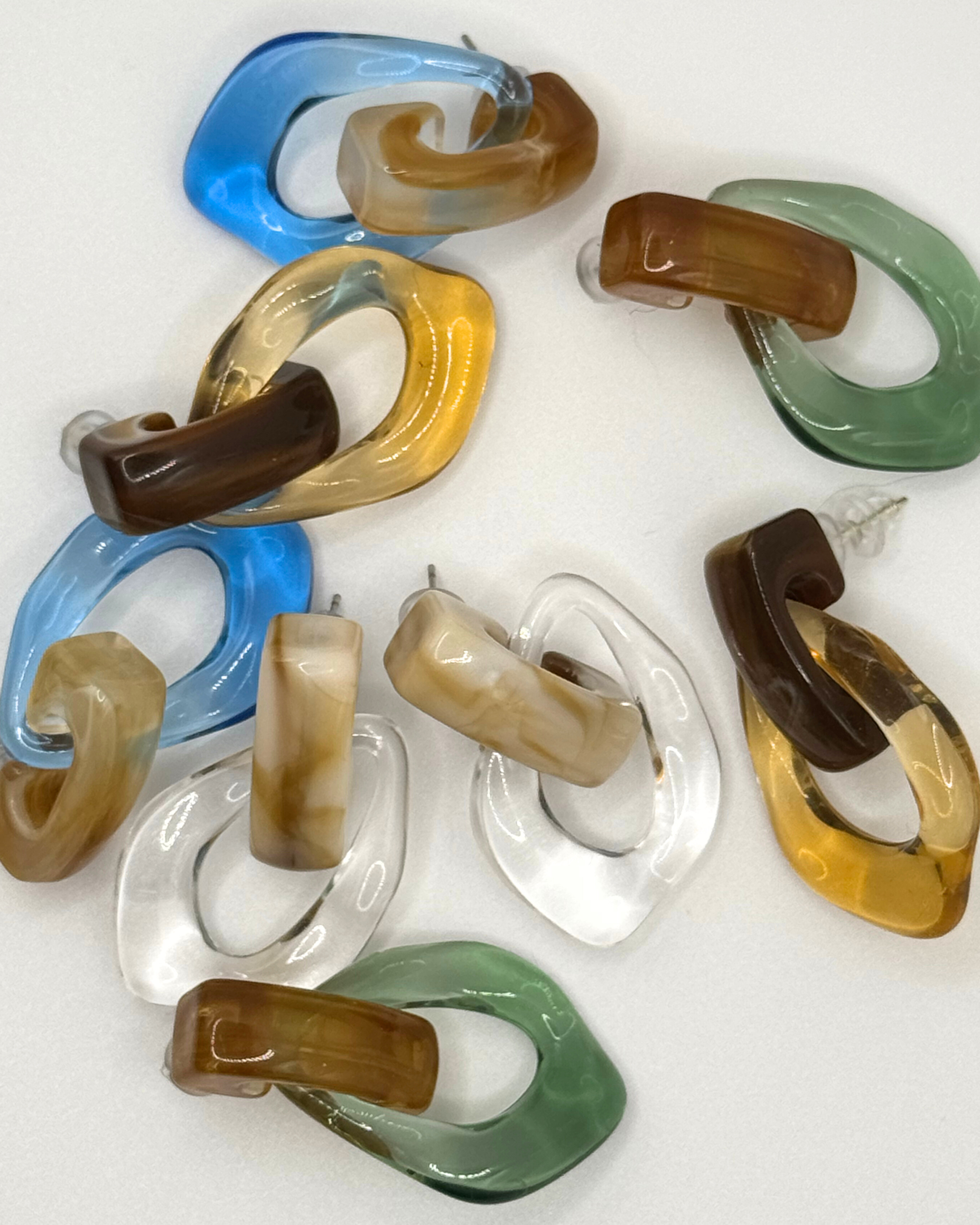FLOAT earrings by Emilia Burk – lightweight waterproof acrylic statement earrings in clear, green, blue and amber