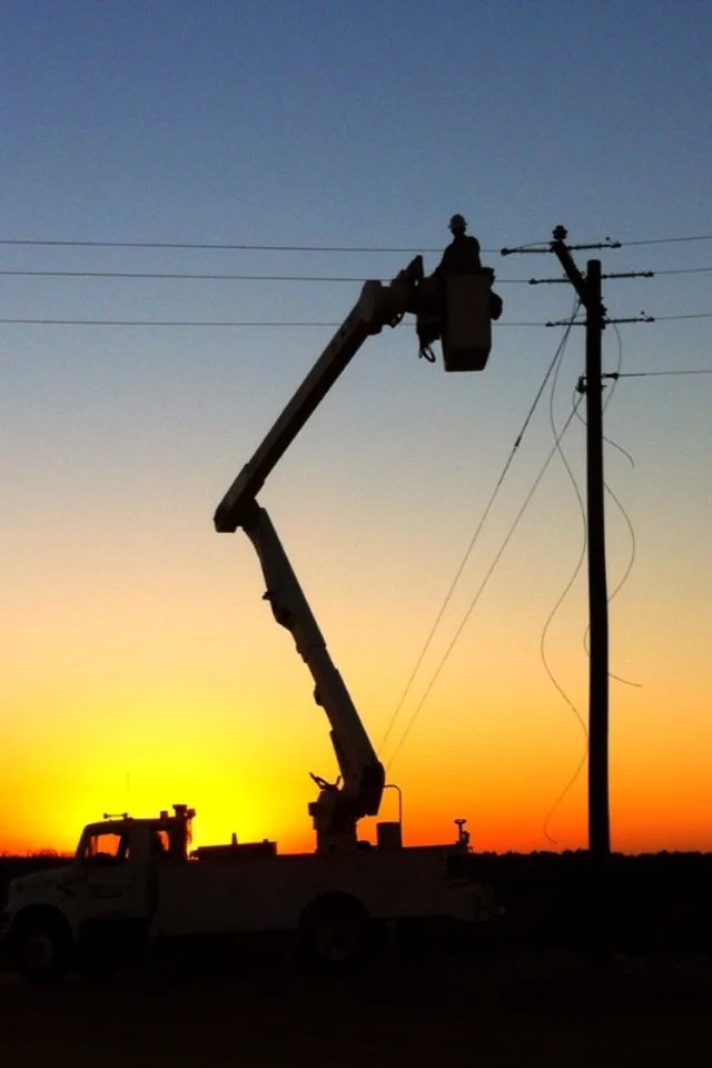 Beautiful shot of a lineman working at sunrise_.jpeg