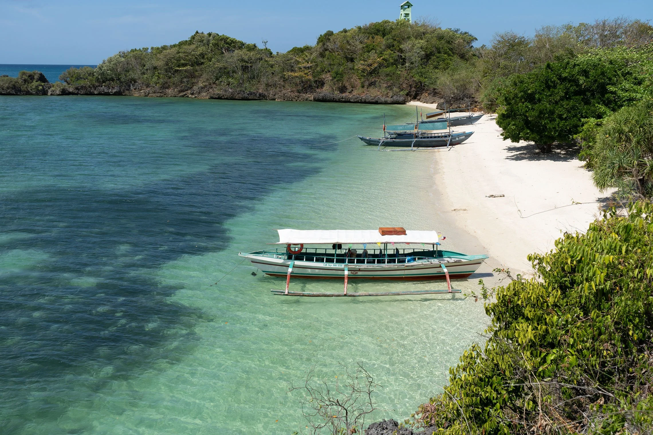 Island hopping in Guimaras Philippines with scenic ocean views and white sand beaches