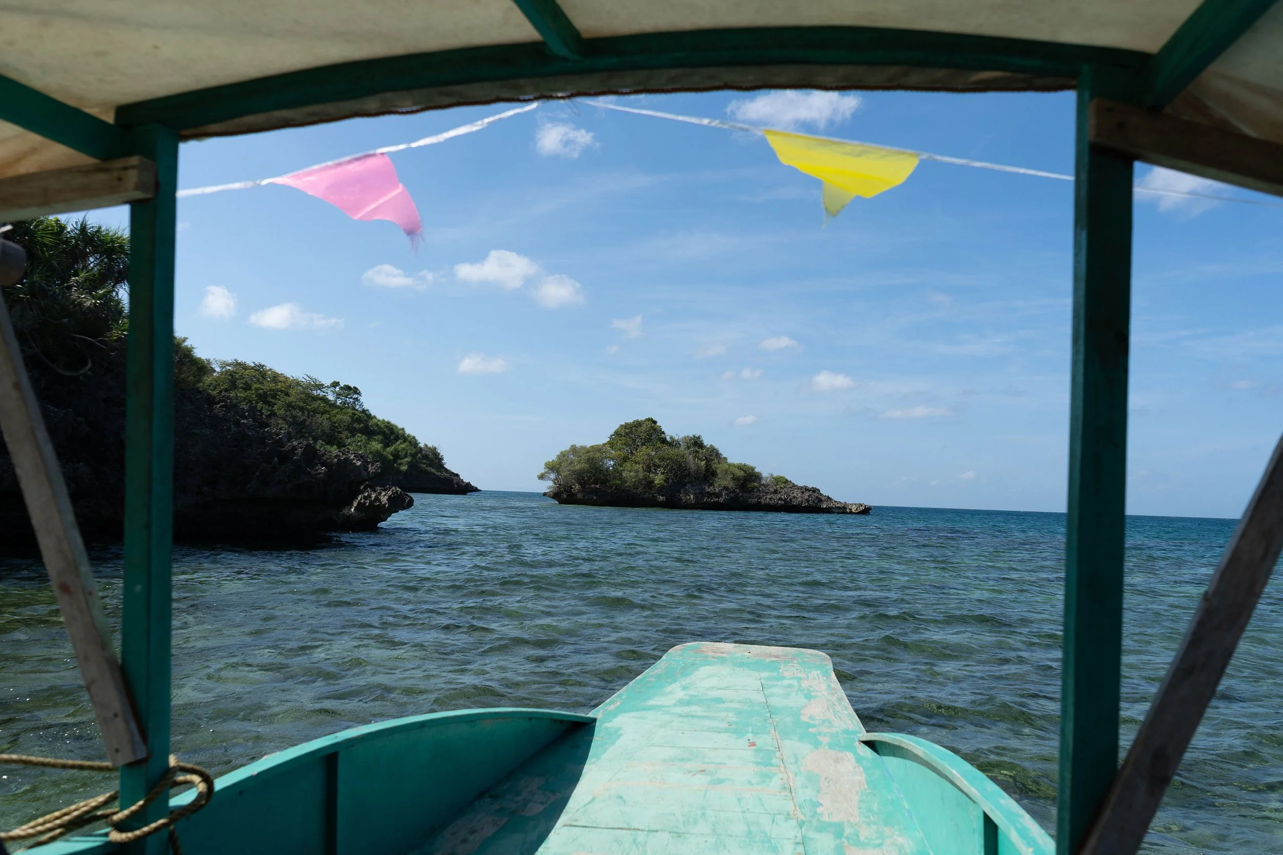 Island hopping boat ride in Guimaras with crystal clear water and tropical scenery