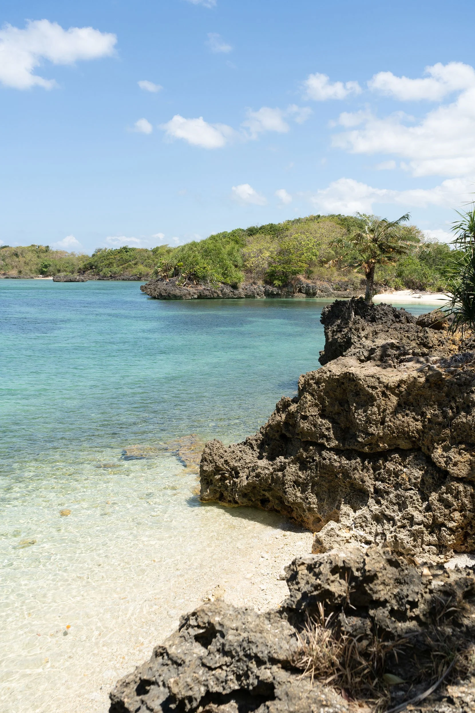 Taklong Island Guimaras island hopping destination with rocky cliffs and blue water