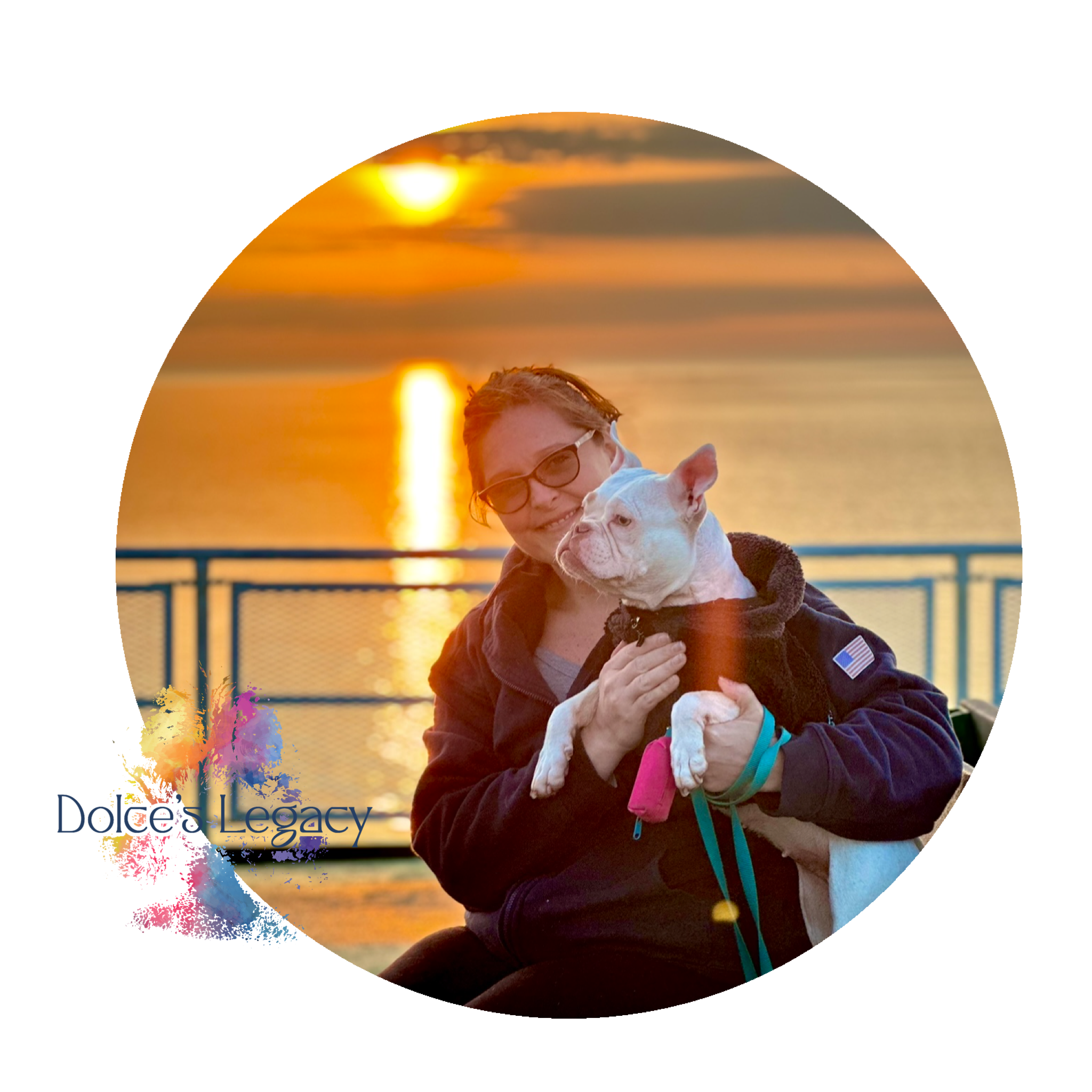 Person holding a white dog in front of a sunset by a fence with "Dolce's Legacy" logo and colorful paint splash design.