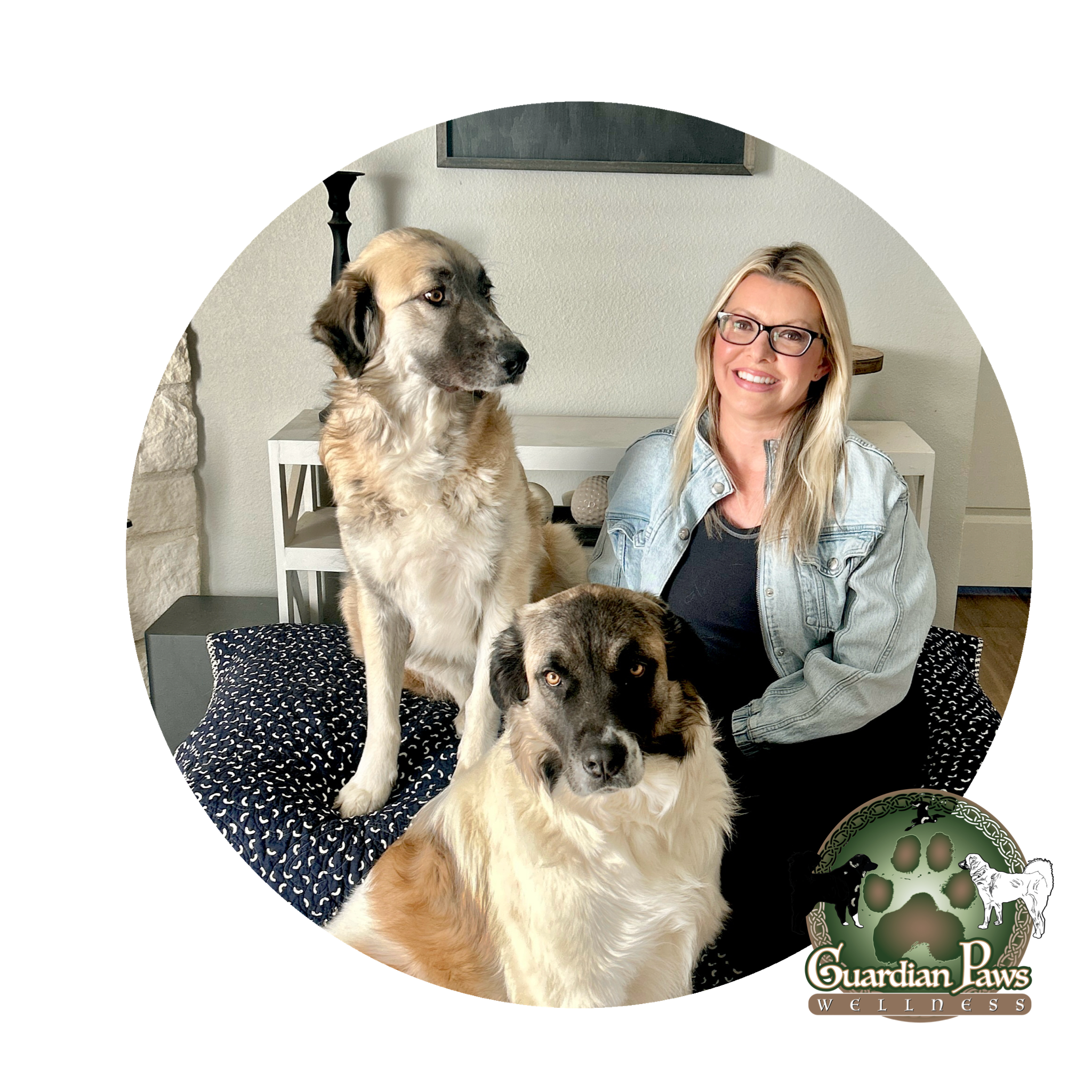 Woman sitting with two large dogs indoors next to Guardian Paws Wellness logo.