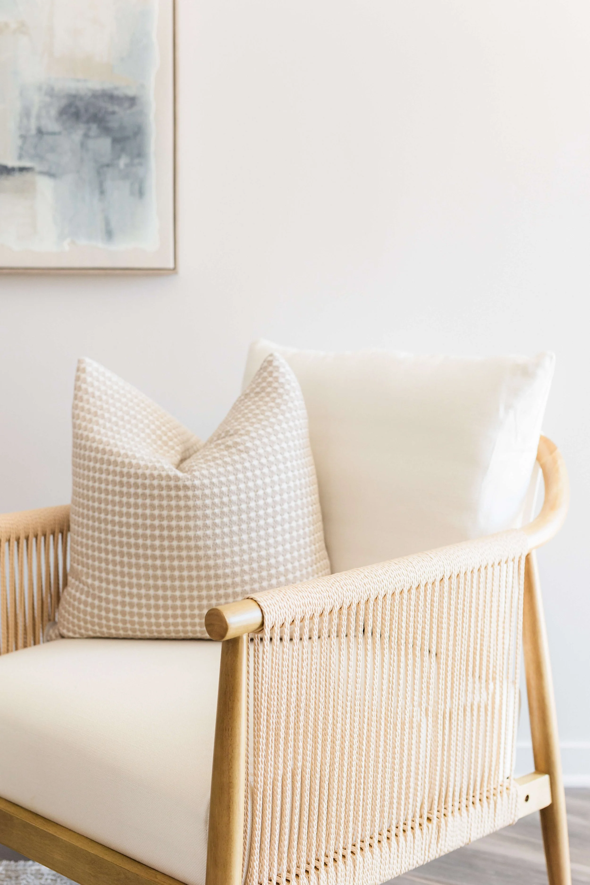 A close-up design moment highlighting a accent chair, layered for a timeless, five-star living room feel.