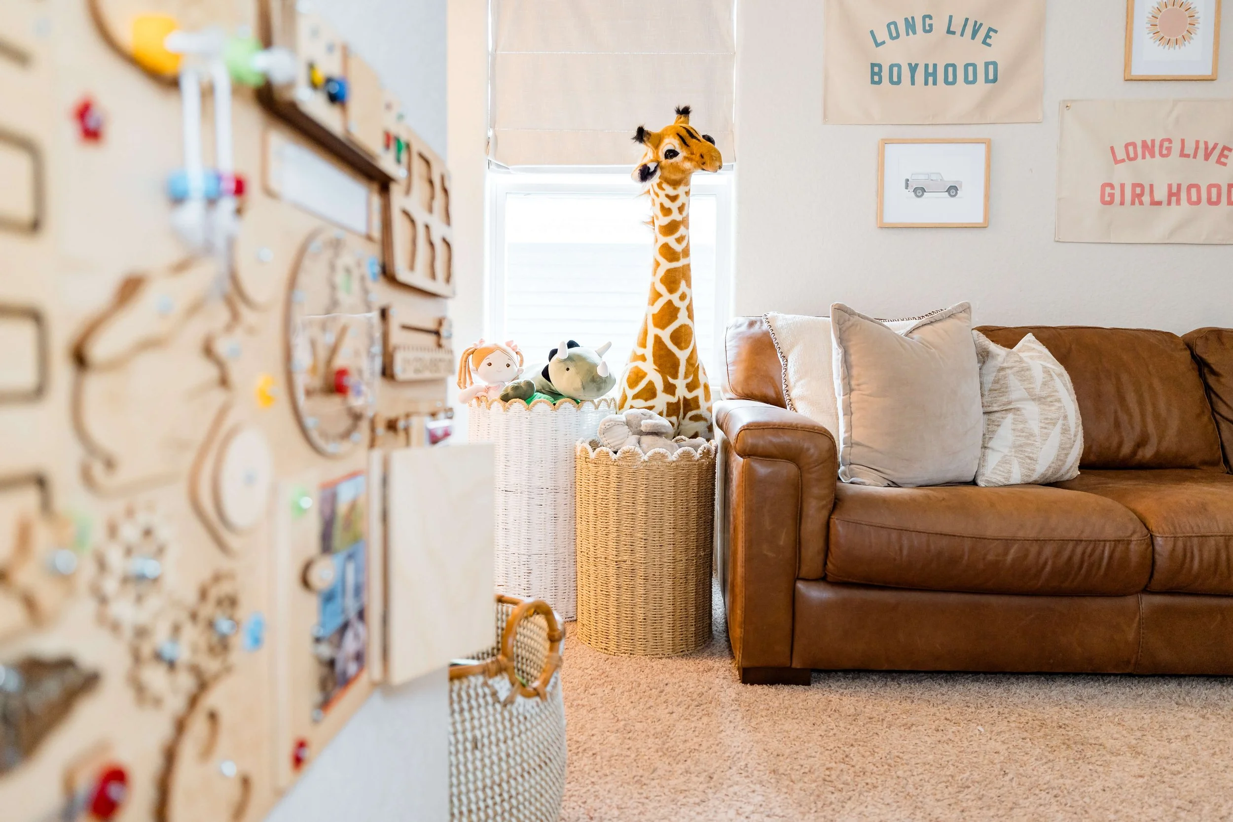 Playroom stuffed animals in laundry baskets for storage.