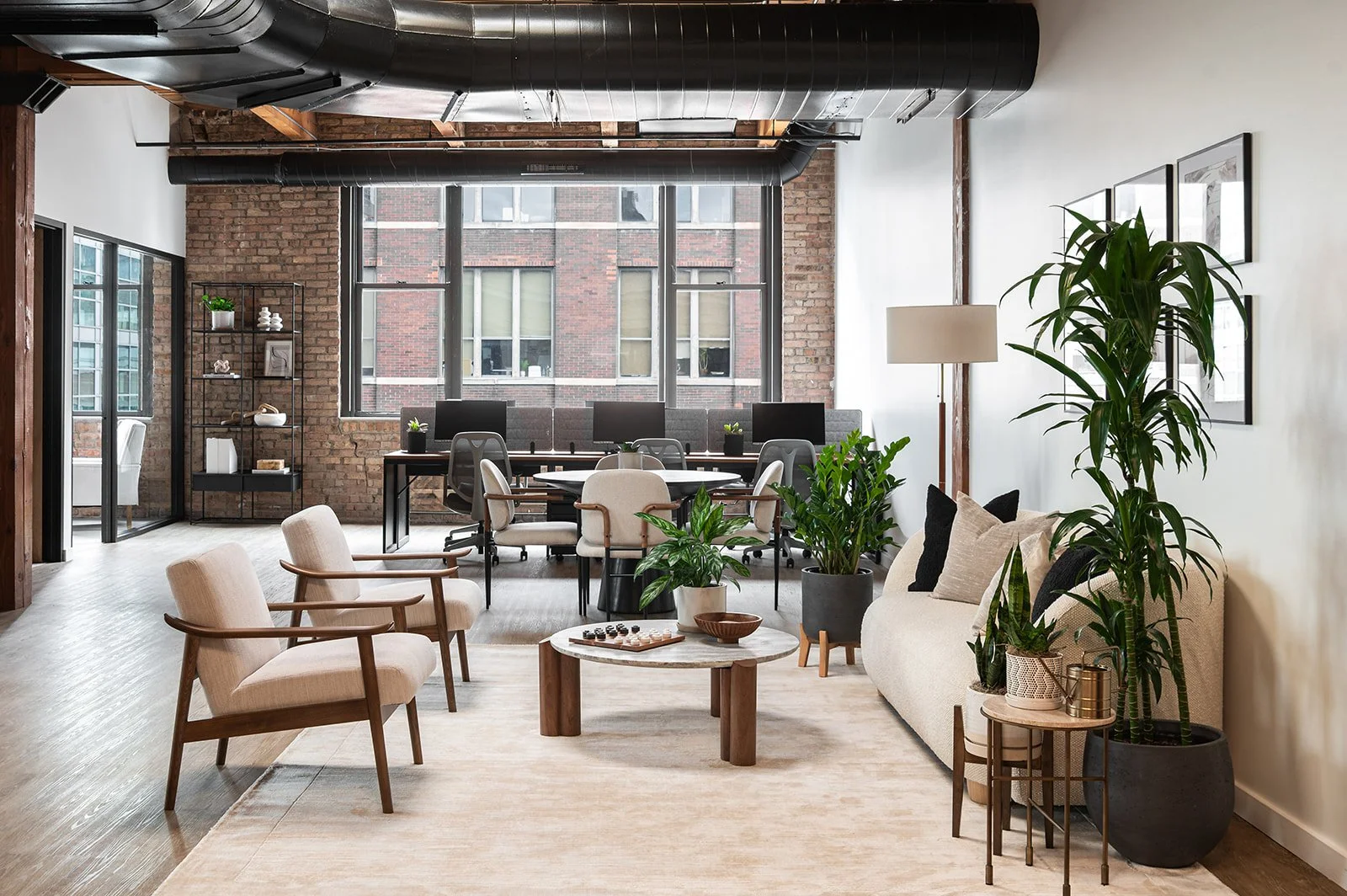 Chicago loft executive office designed for a retail leadership team with open workspace, lounge seating, and natural light.