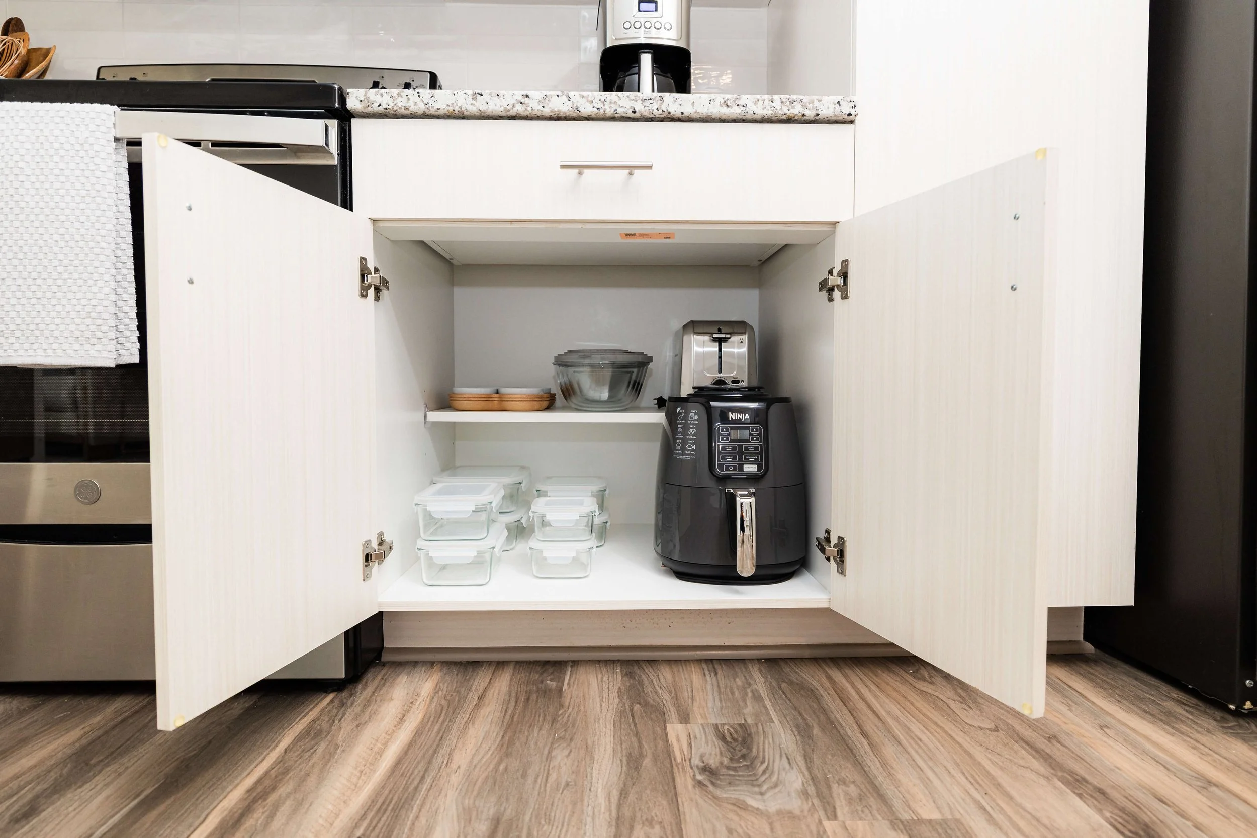 Kitchen appliances seamlessly integrated into modern, timeless cabinetry for an elevated resort-style kitchen.