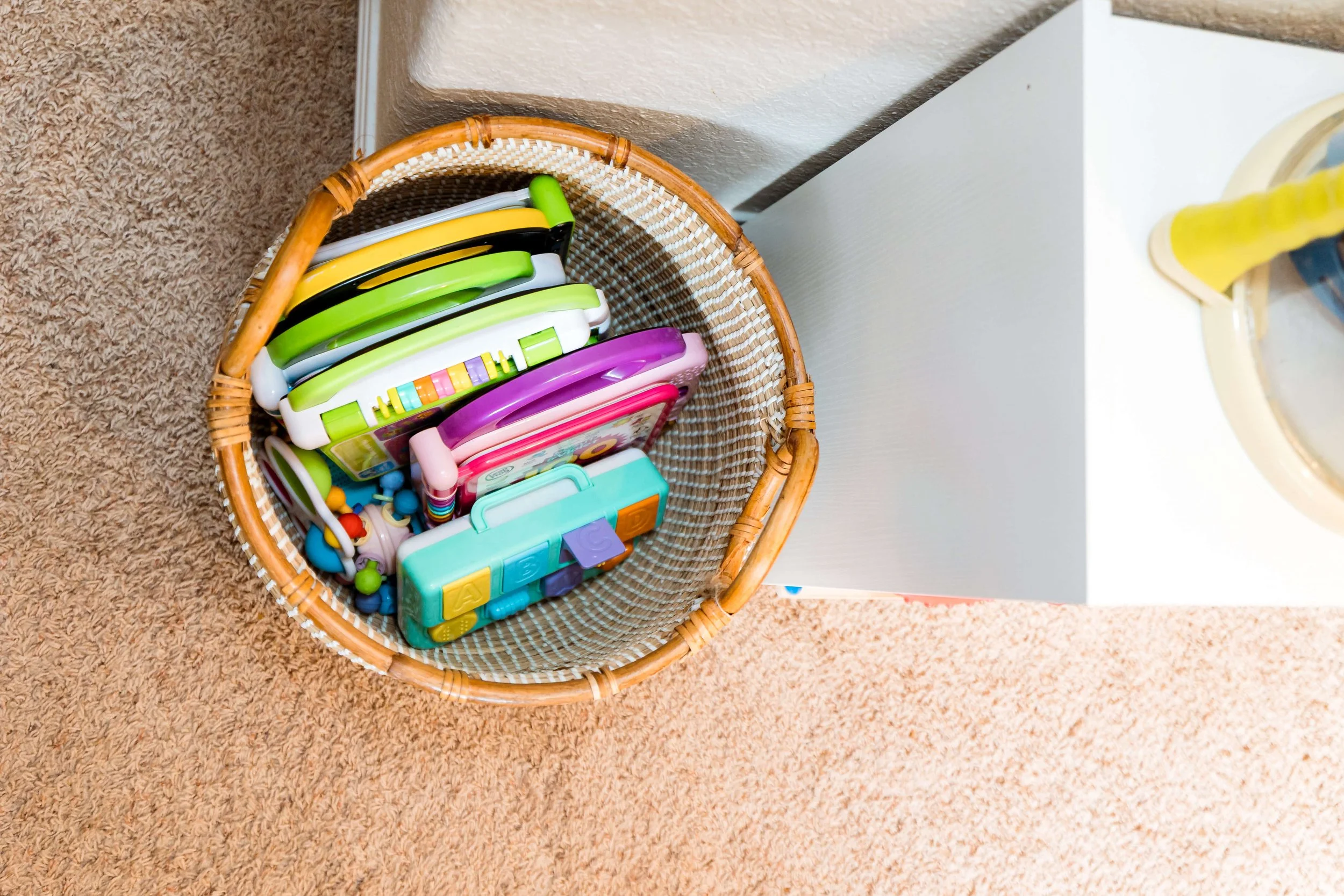 Educational toys in basket for storage.