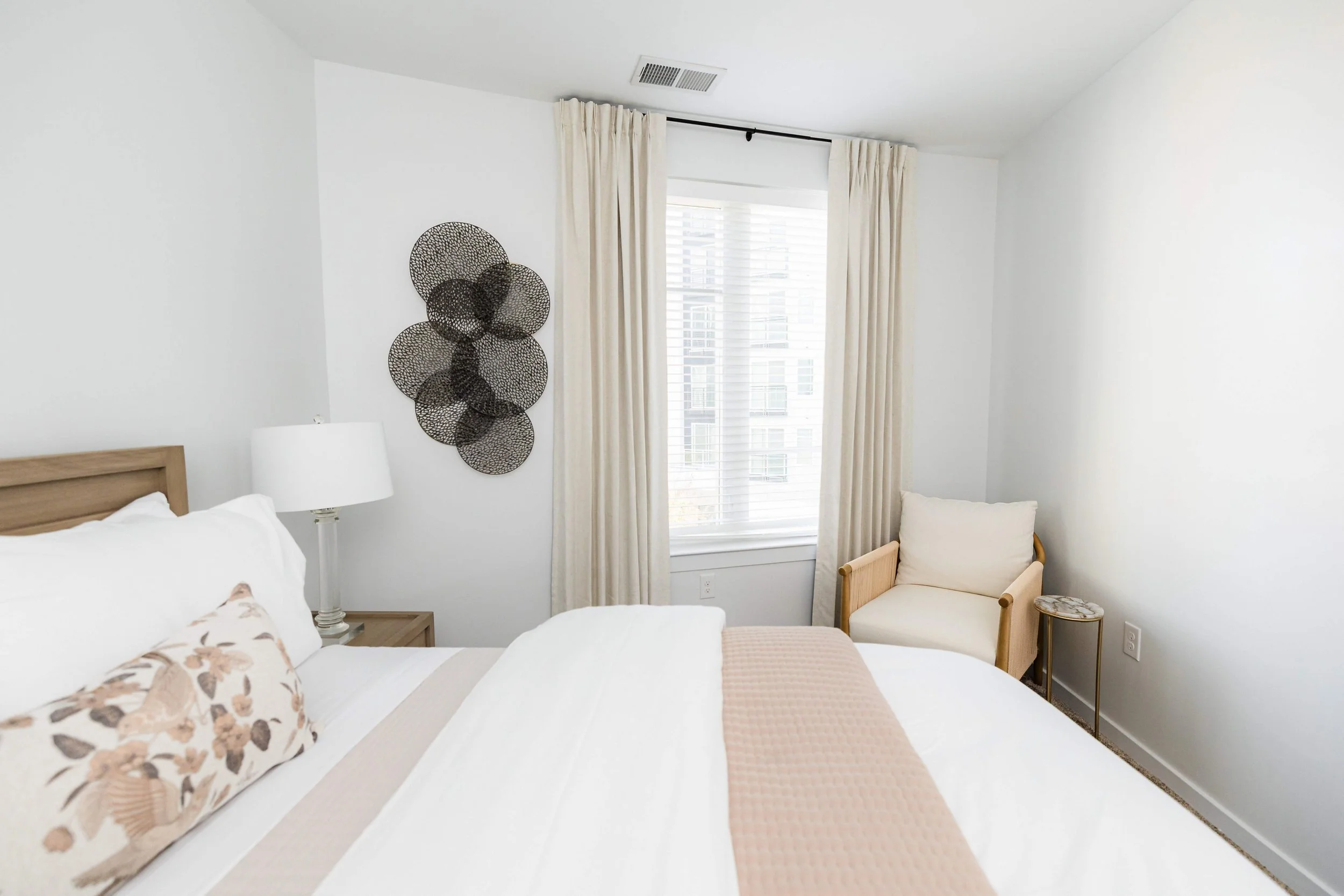 A serene, modern coastal master suite by CarMELLA Design Studio — luxury, comfort, and timeless style all in one space.