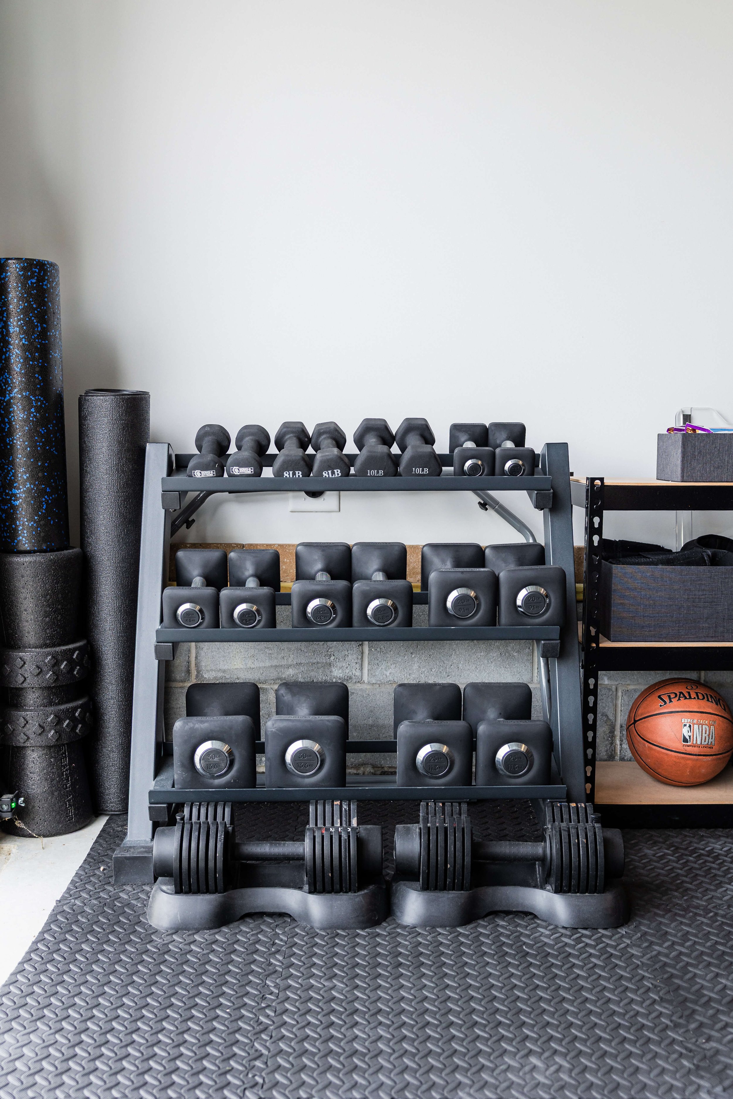Weight rack storage in home garage gym 