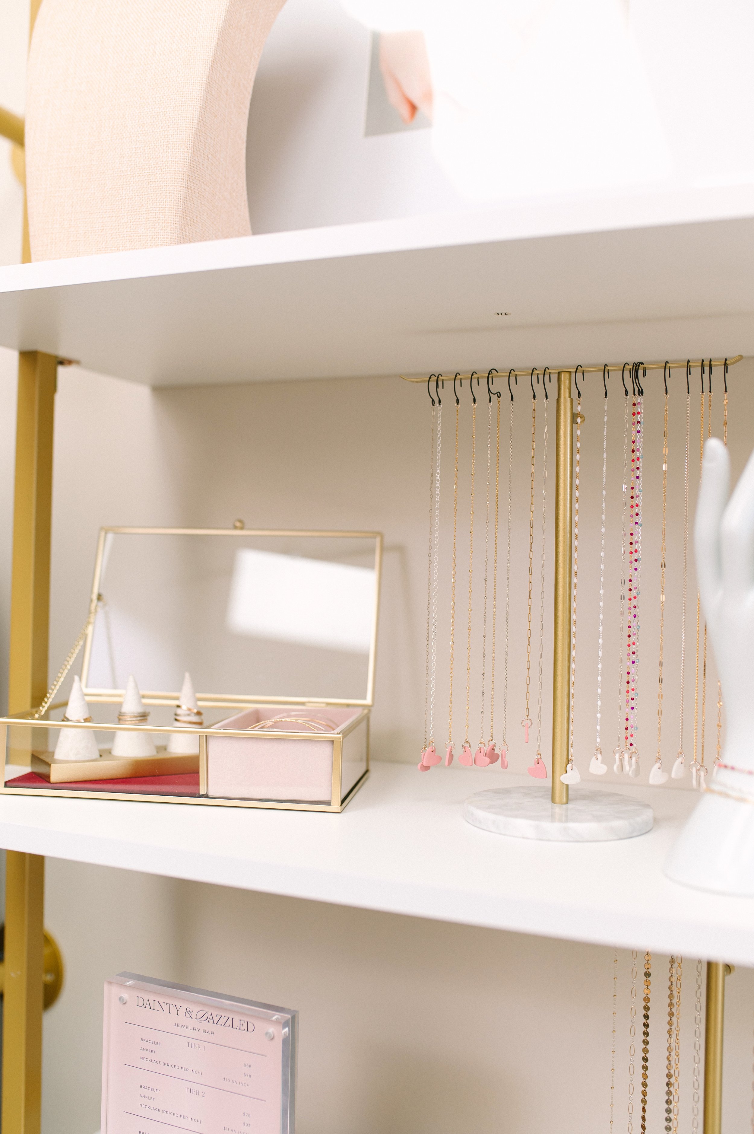 Close up of visual merchandising for permanent jewelry retail space. 