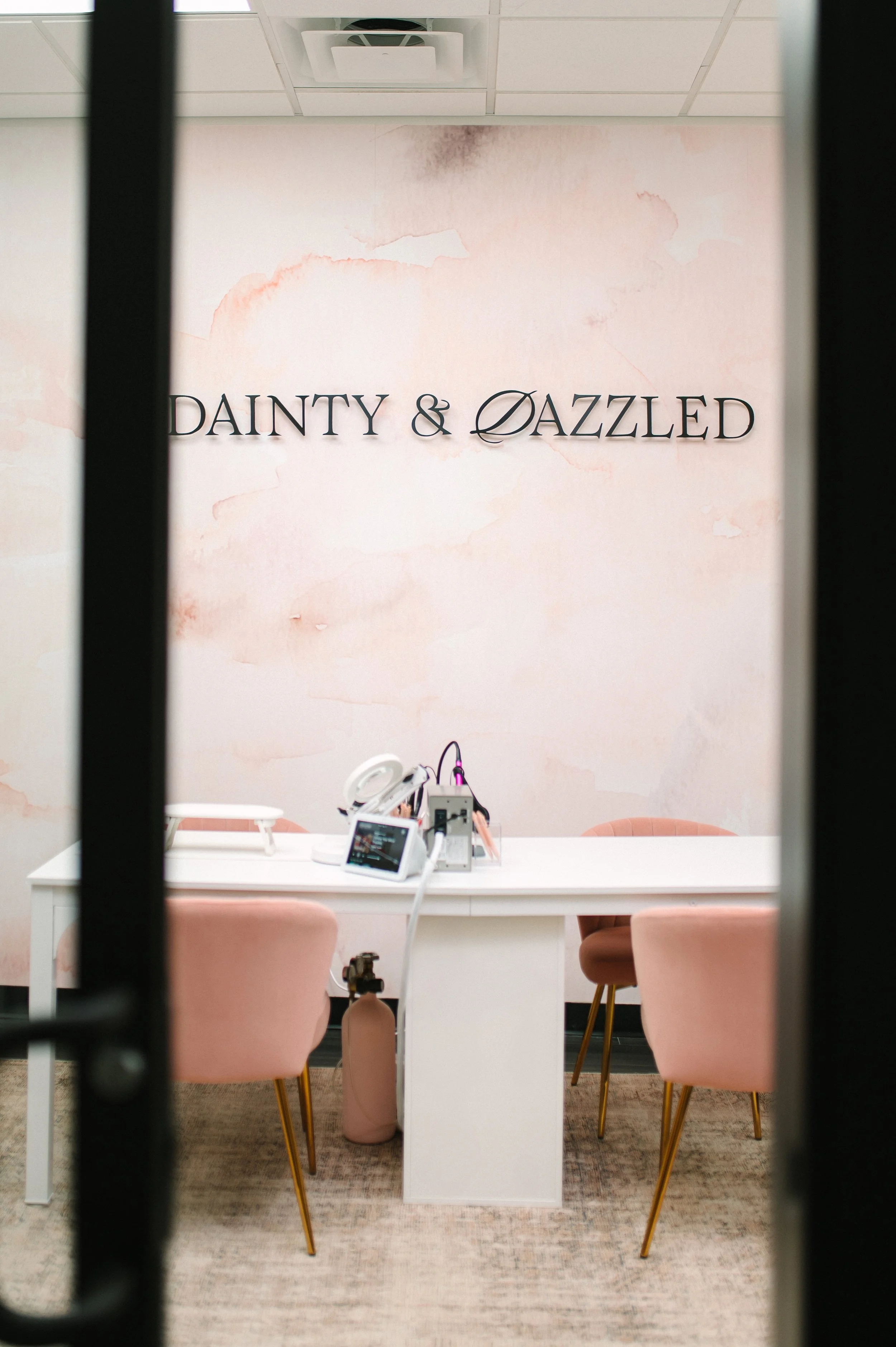 Danity and Dazzled wall logo in retail space