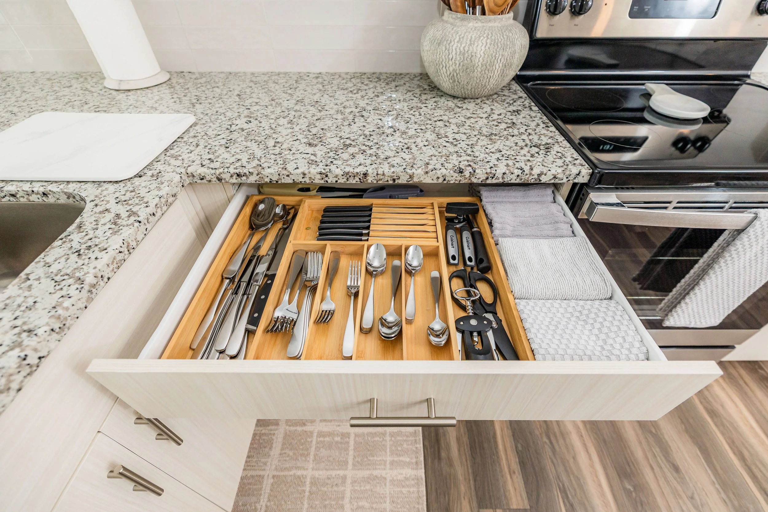 A detailed look at thoughtfully organized utensils, blending efficiency with five-star resort-inspired coastal style.