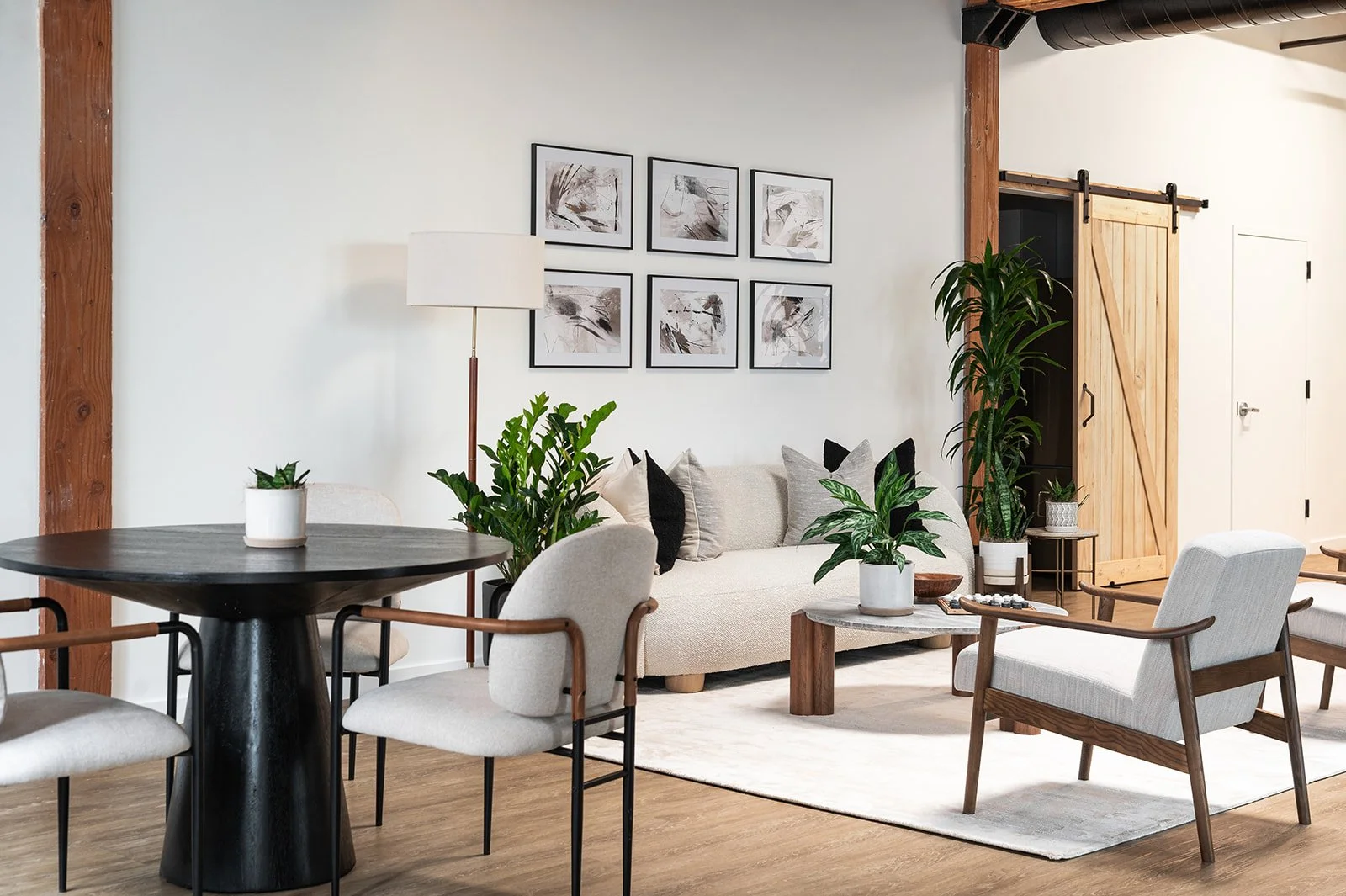 Executive office lounge collaboration space in a Chicago loft designed with modern furnishings and layered textures.