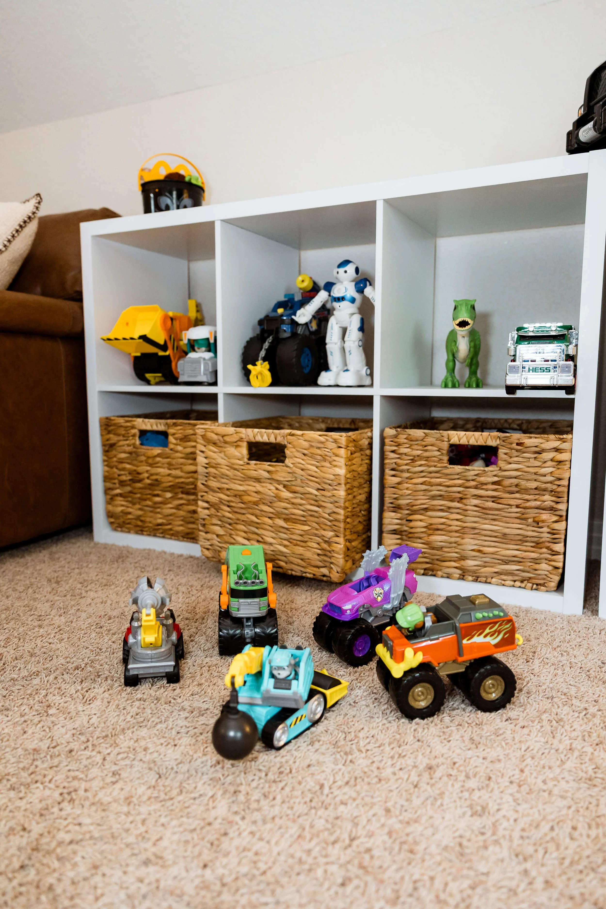 Storage bins in playroom with boys trucks