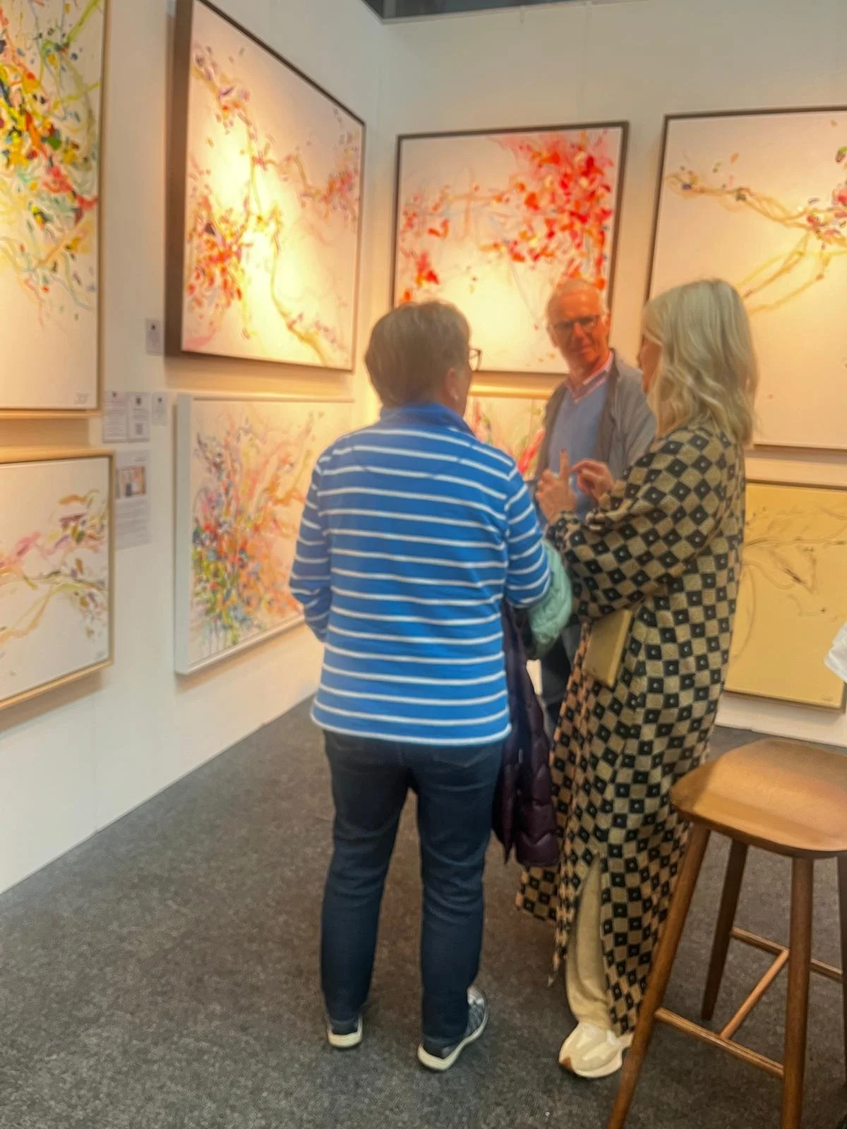 Talking to clients at art show