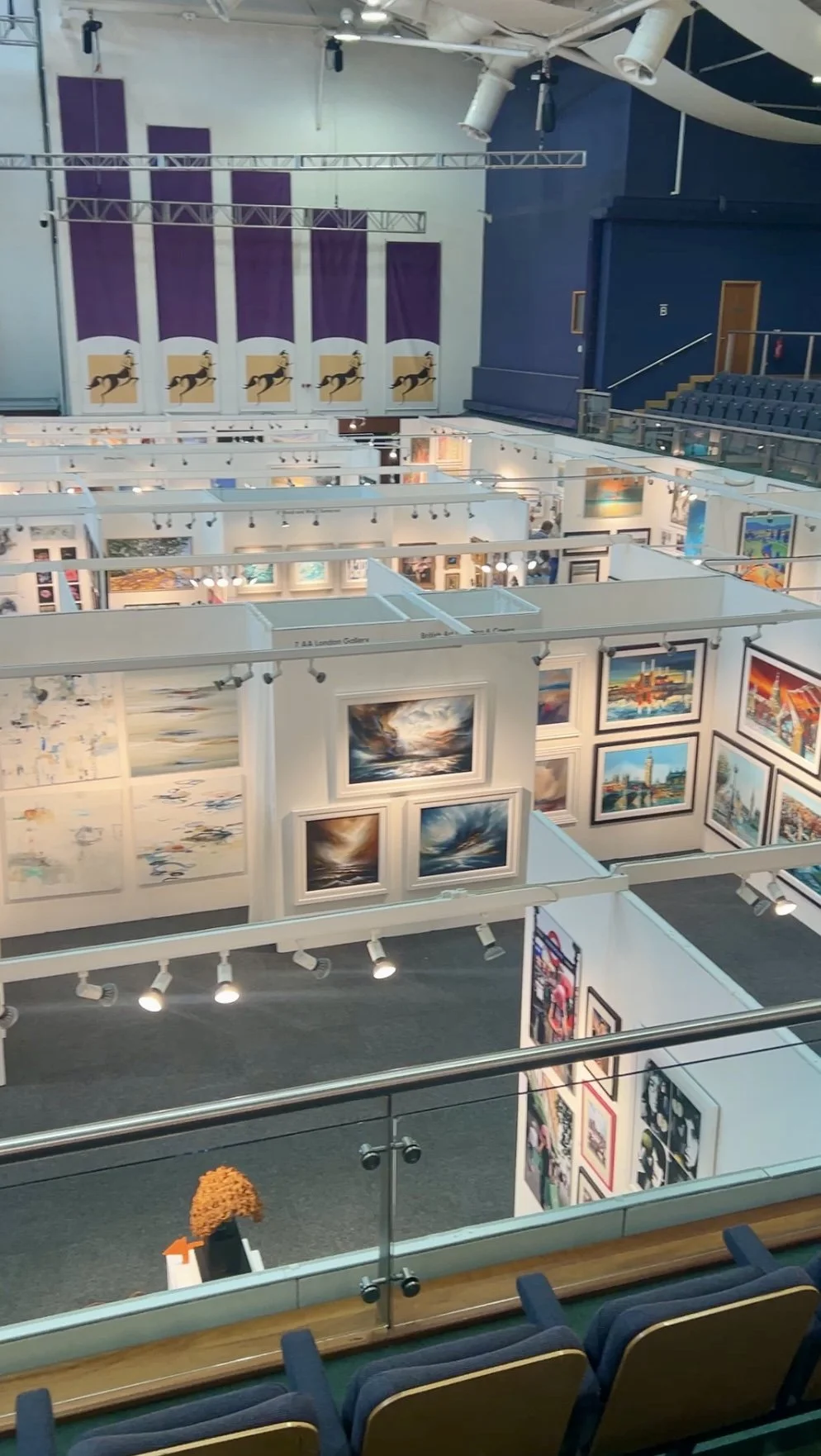 Overhead view of stands at art exhibition