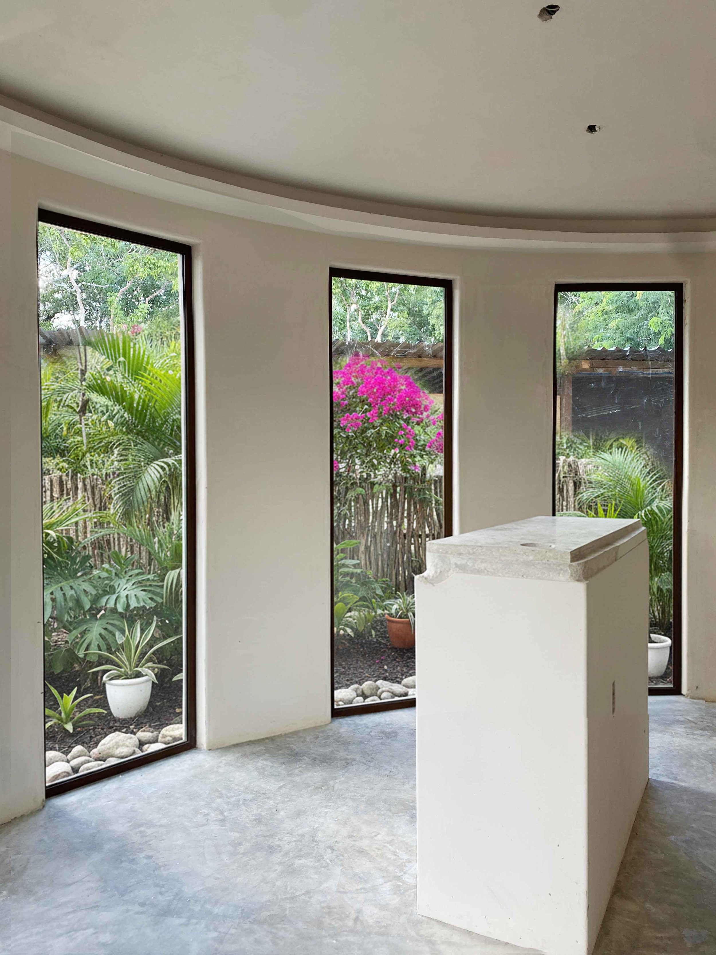 Natural materials and artisan craftsmanship used in the construction of eco-conscious homes in Tulum.