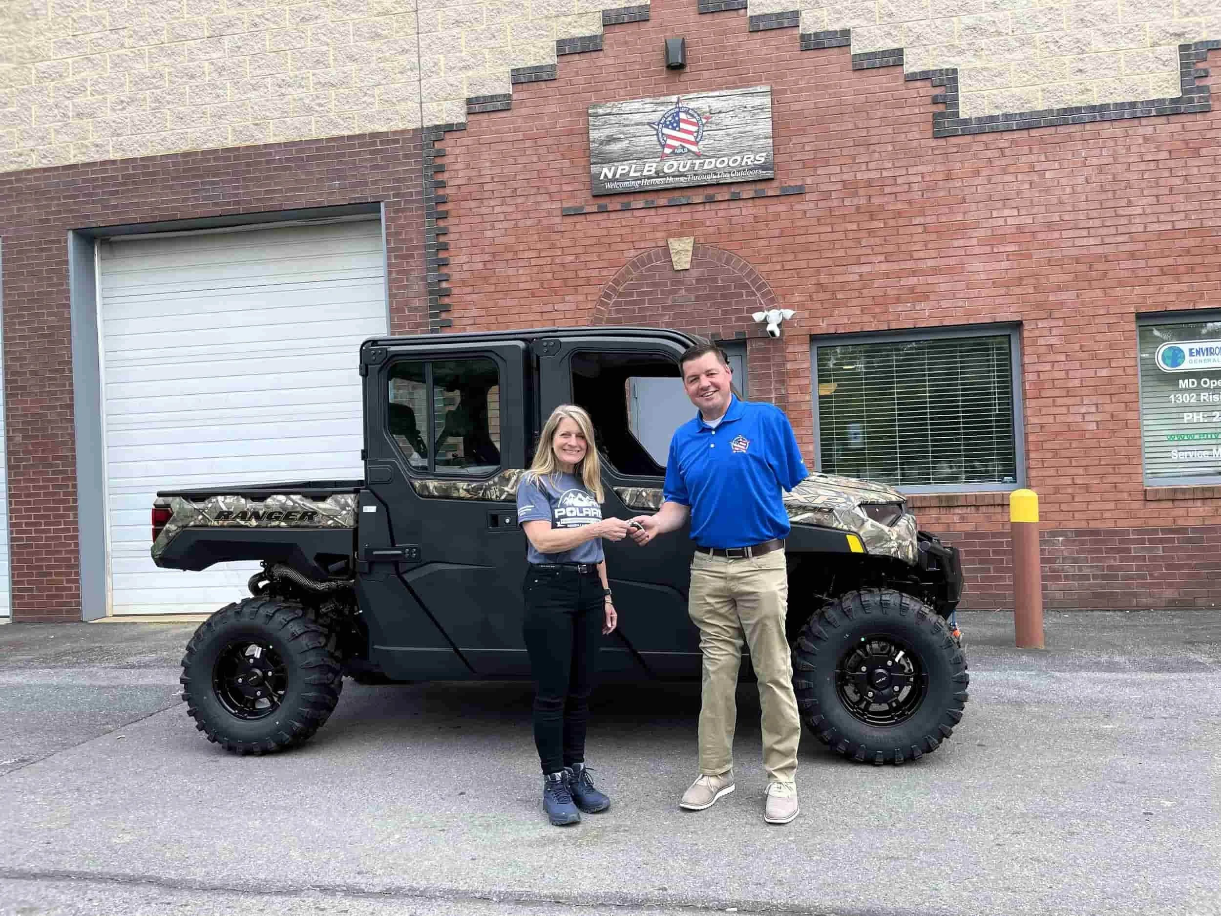 NPLB Outdoors receiving a donated Polaris Ranger utility vehicle to support adaptive outdoor programs for wounded veterans.