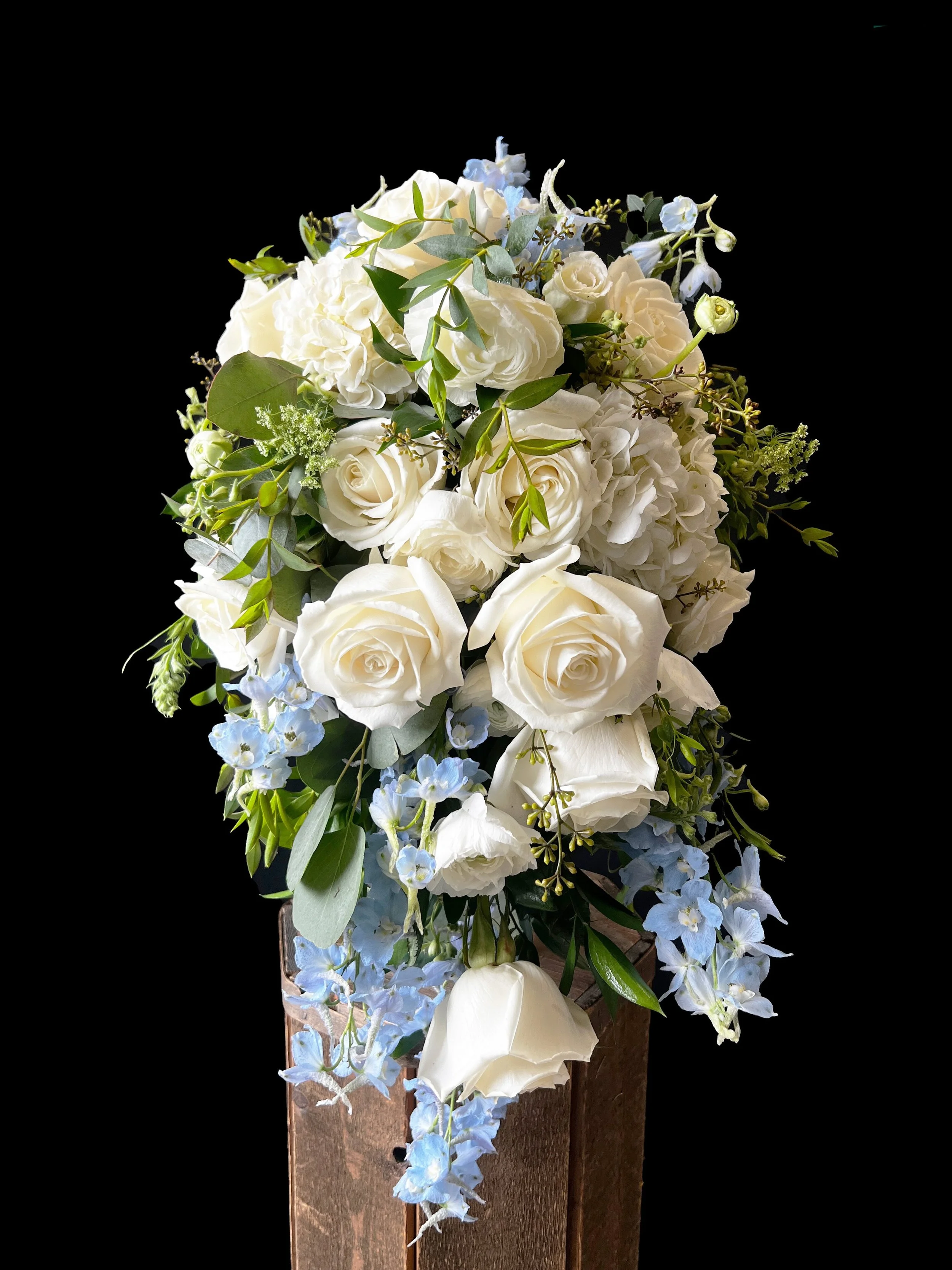 A beautiful bridal bouquet that we created last week for one of our brides! We are obsessed with this blue, white and green color palette! We also did some table arrangements in a beautiful two toned hydrangea for a wedding as well! If you are ever h