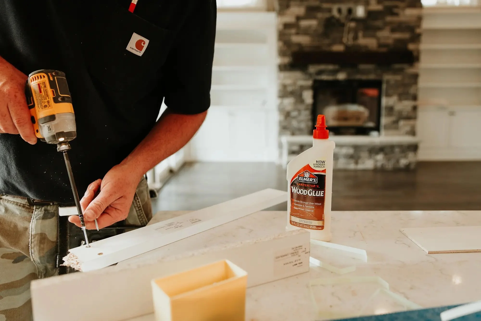 a technician prepares to install a fireplace