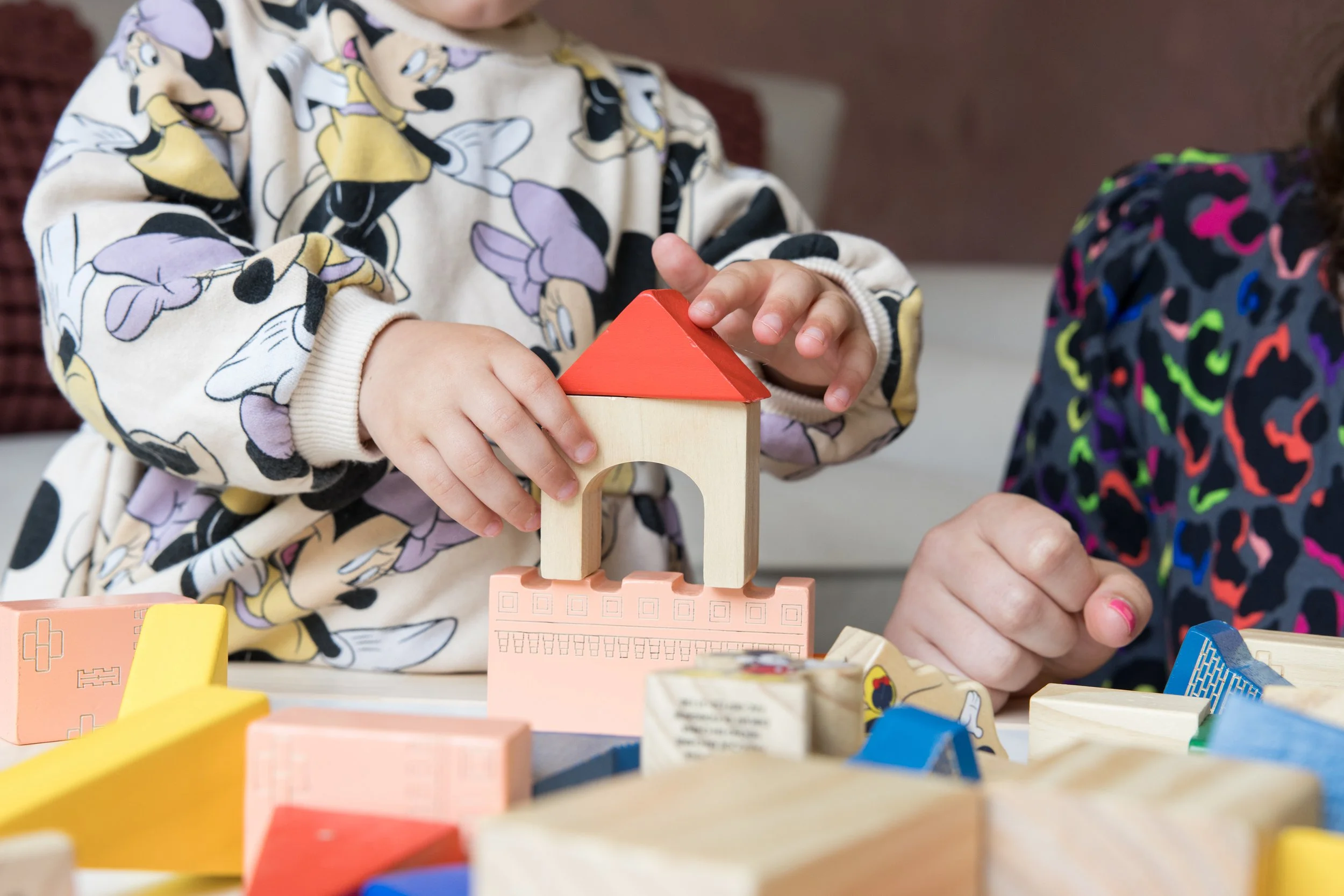 Young child playing with sensory toys to support early learning and development with educational psychologist