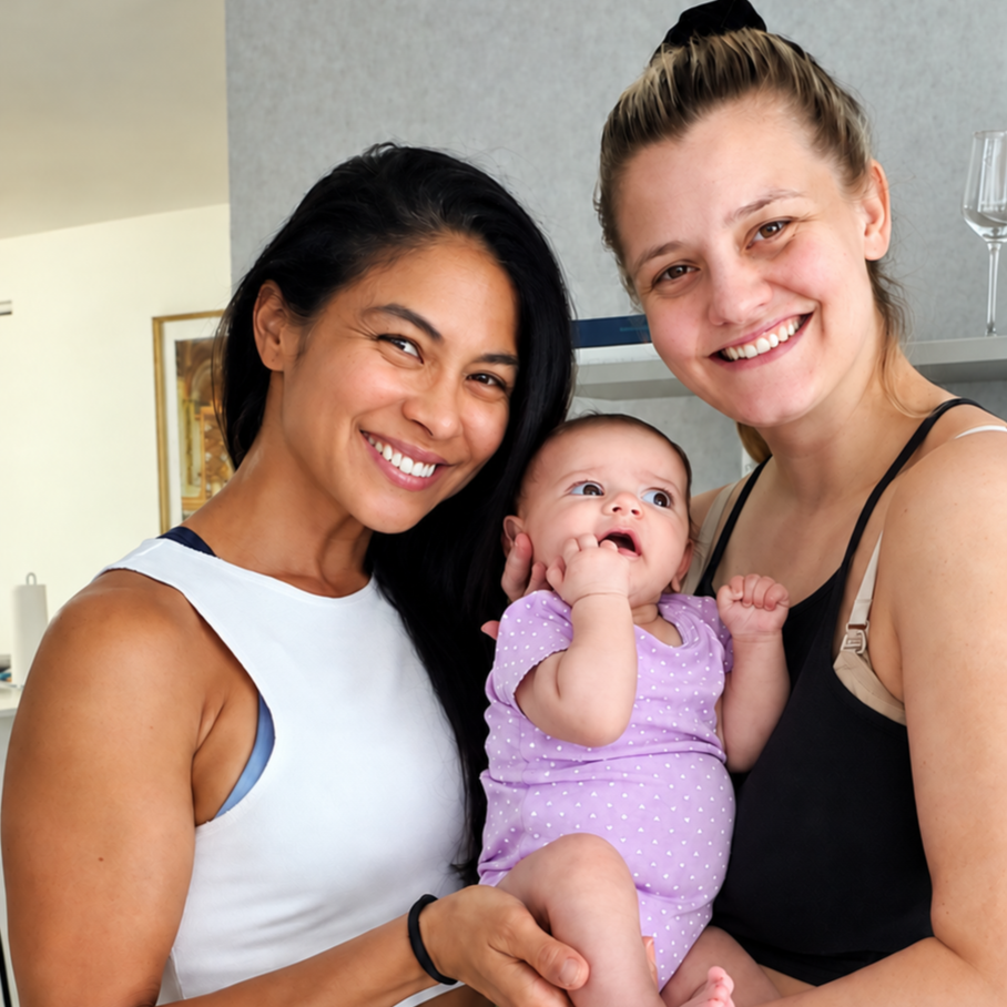 Mom & baby. New mother holds her newborn after birth besides personal trainer Lyen Wong during a Postpartum recovery training session.