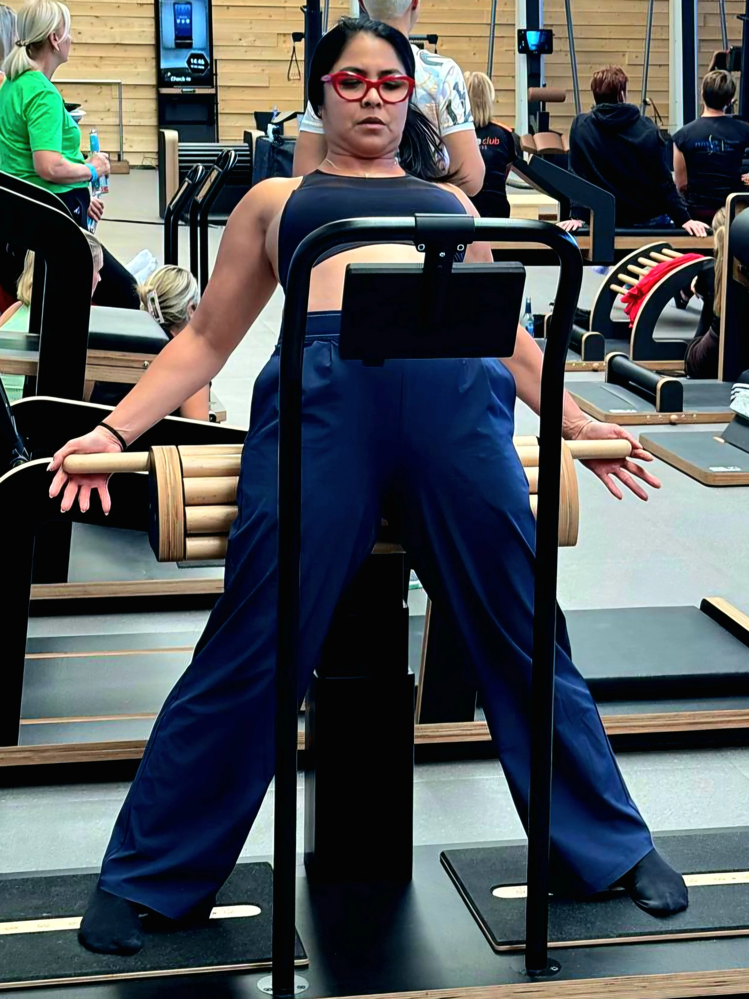Lyen Wong doing a mobility exercise on the five Konzept hip opener and adductors stretch machine in Germany as she adapts her training during perimenopause.