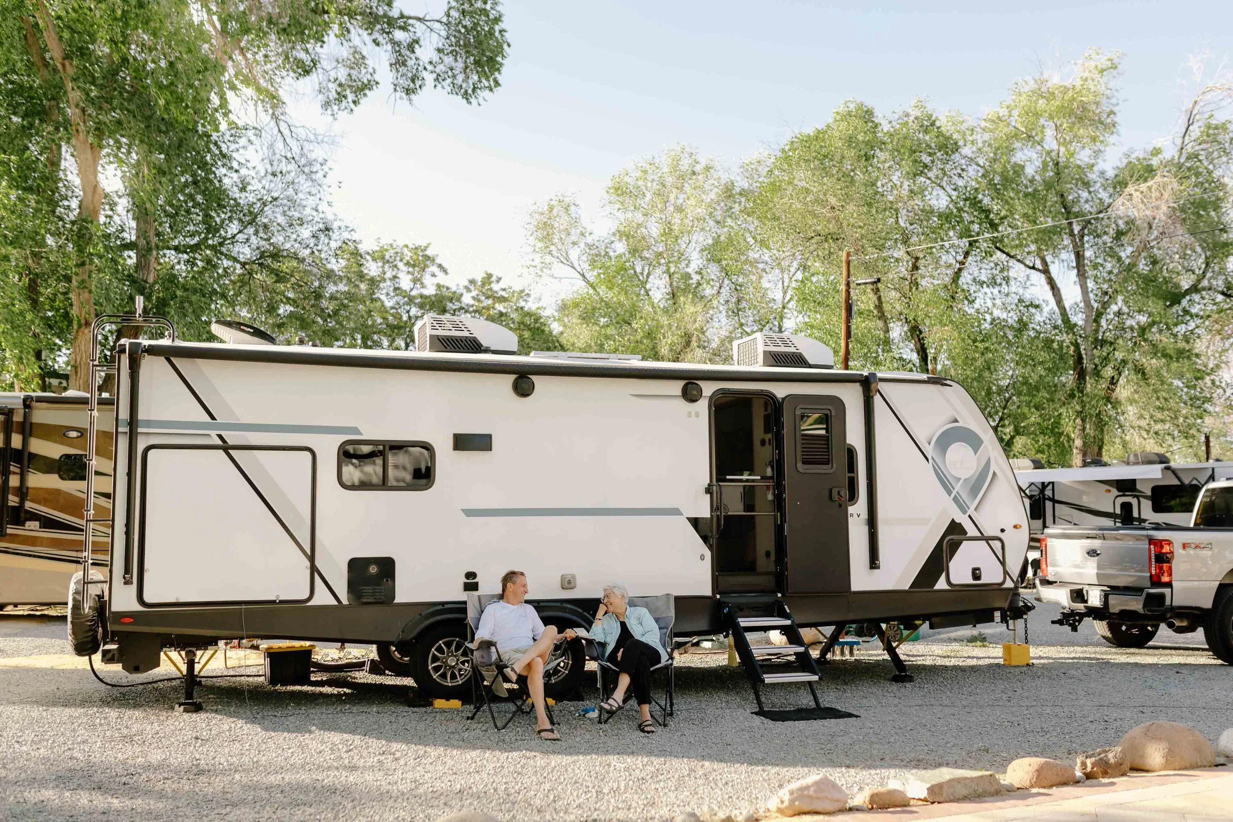 two people sitting outside an RV.jpg