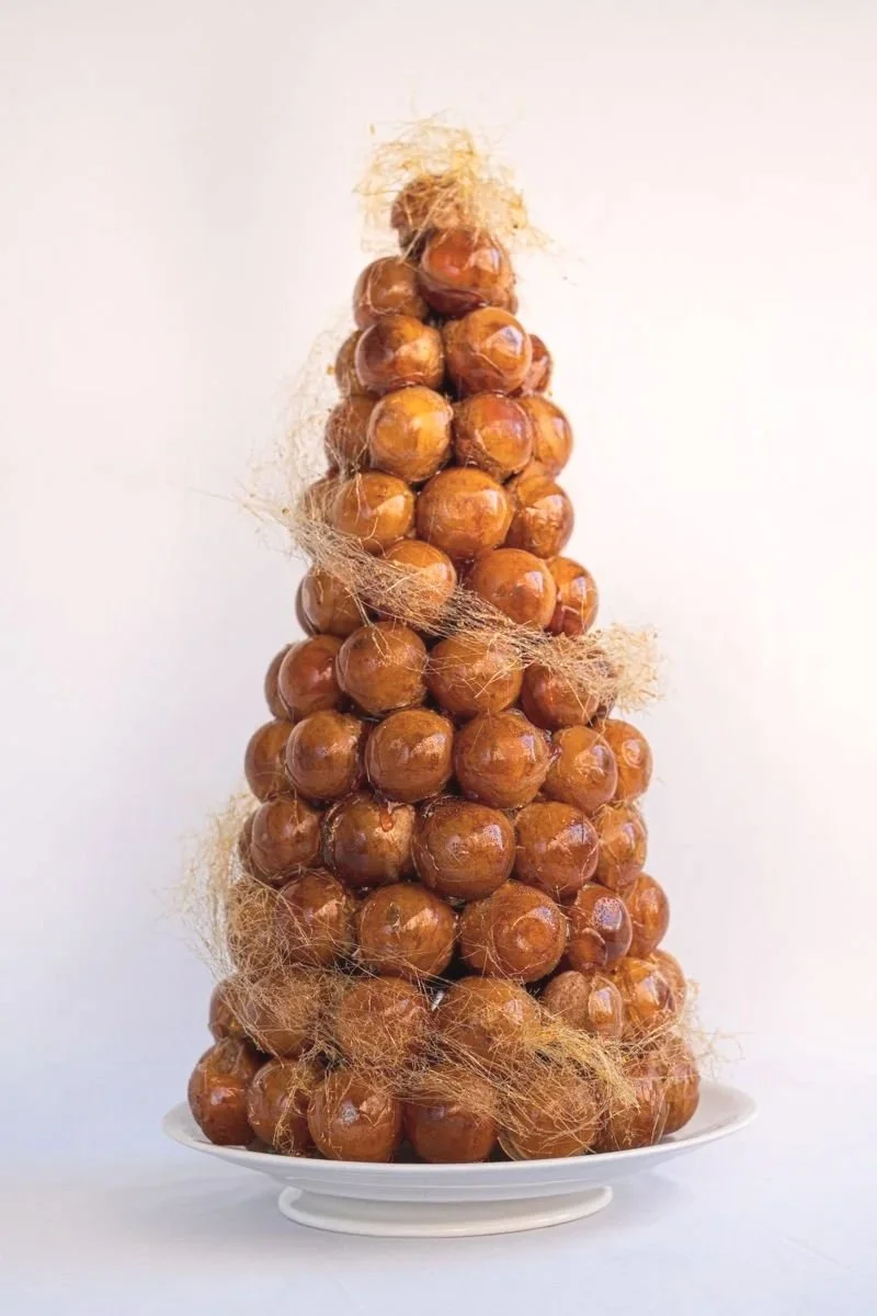 French patisserie. French pastry. Croquembouche for wedding celebration